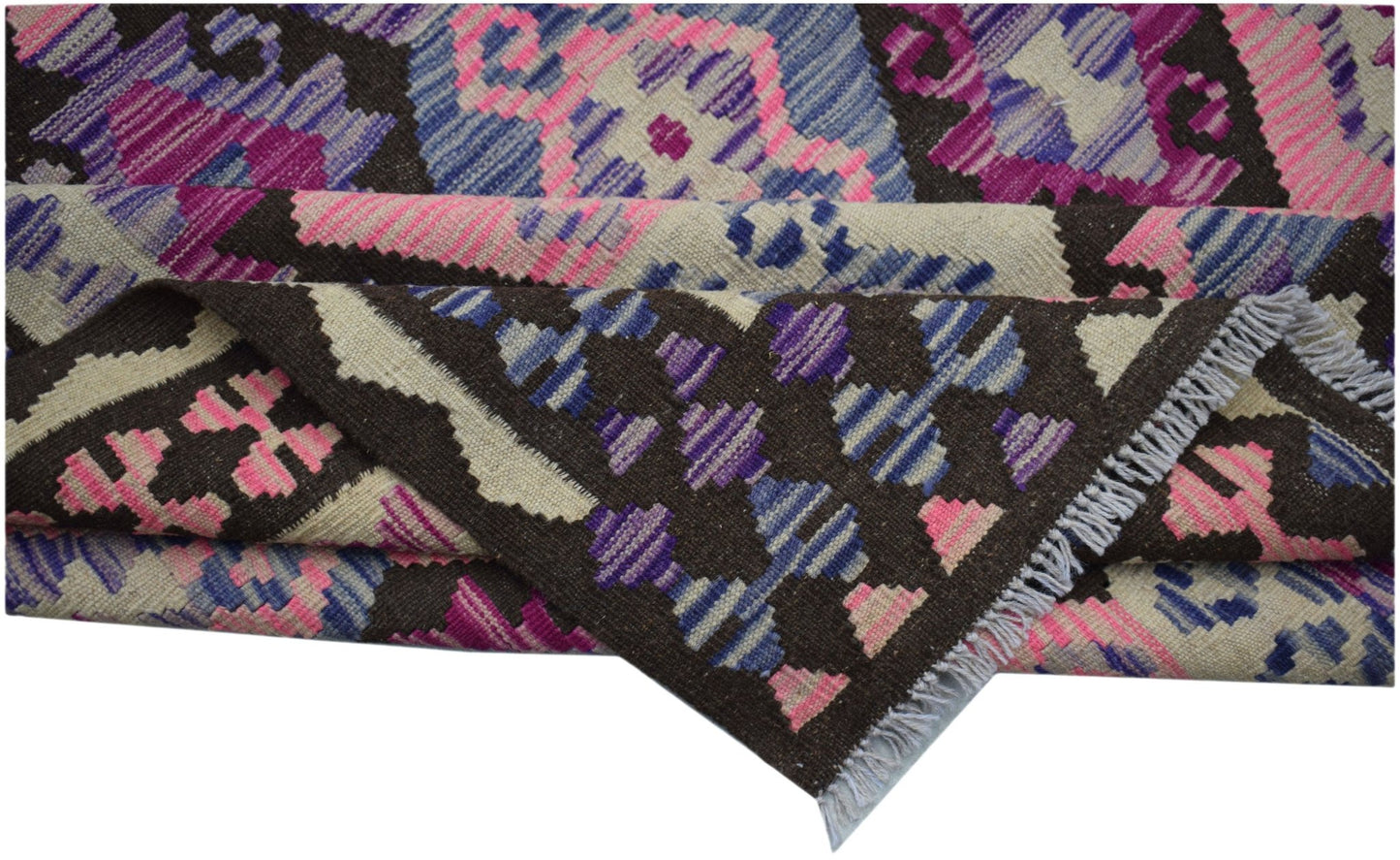 Handwoven Afghan Maimana kilim rug featuring a geometric pattern in pink, blue, and brown wool.