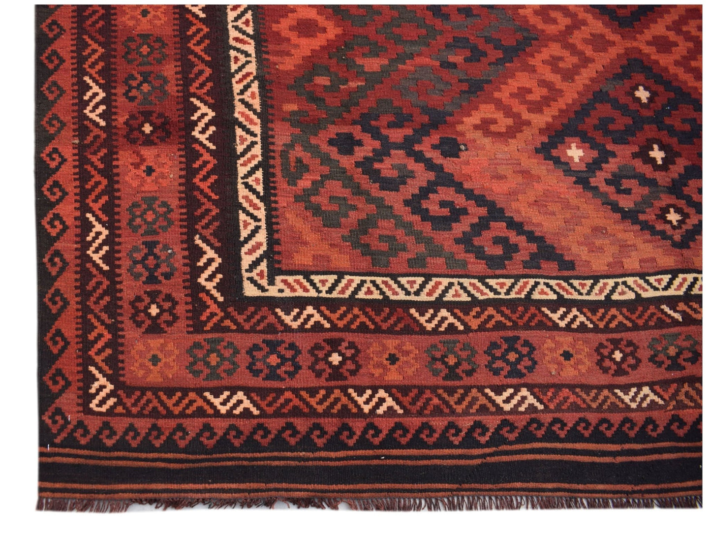 Handwoven Afghan Maimana kilim rug featuring geometric patterns in shades of red and black.