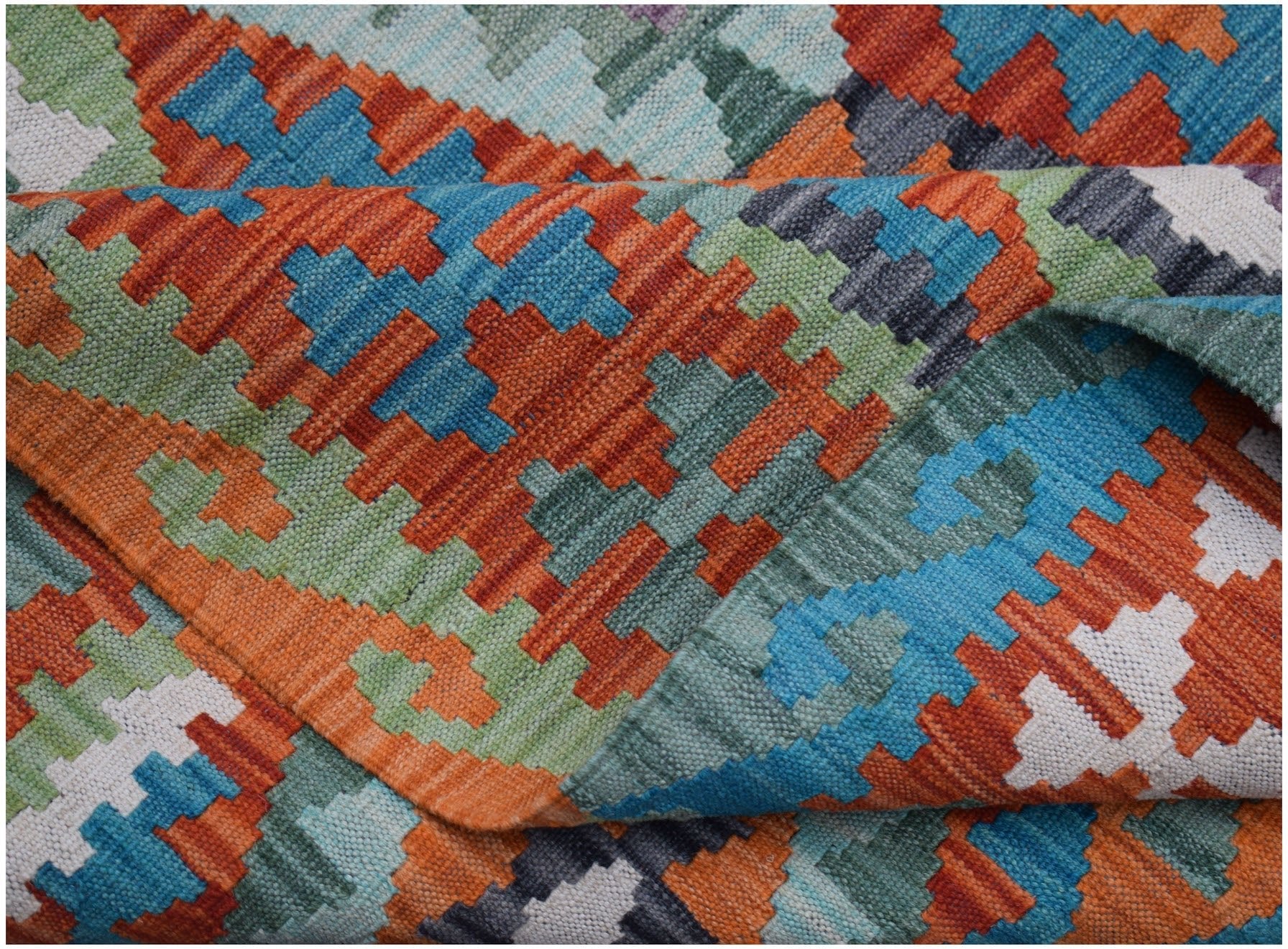 Handwoven Afghan Maimana kilim rug featuring a vibrant geometric pattern in orange, blue, and green.