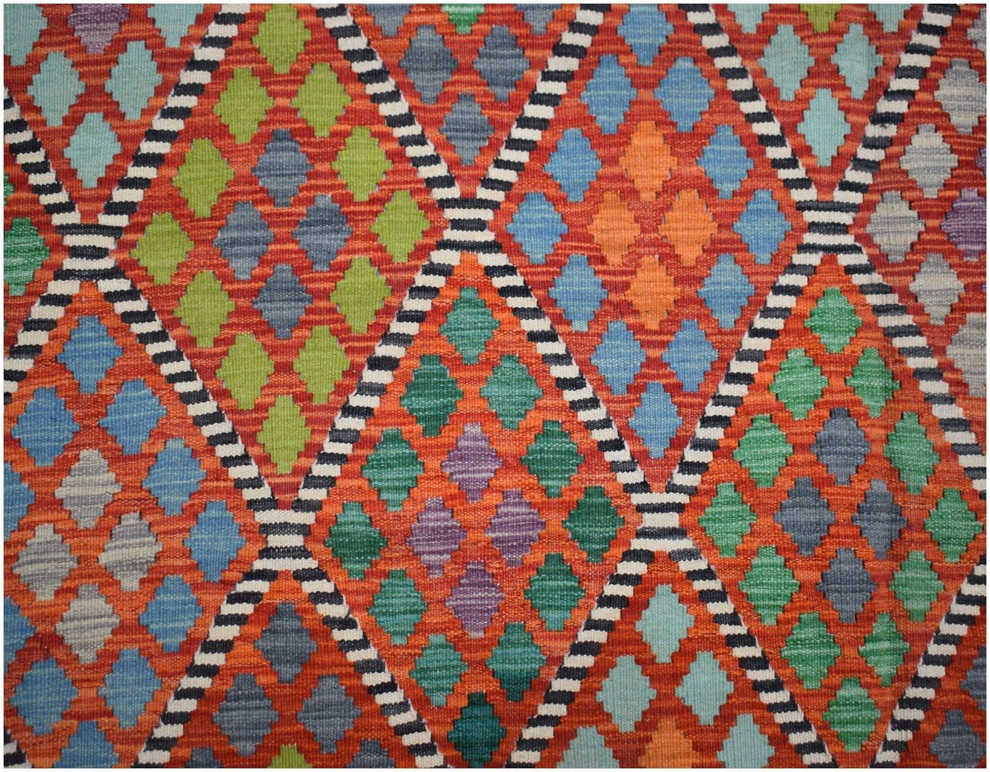 Handwoven Afghan Maimana kilim featuring a vibrant geometric diamond pattern in wool.