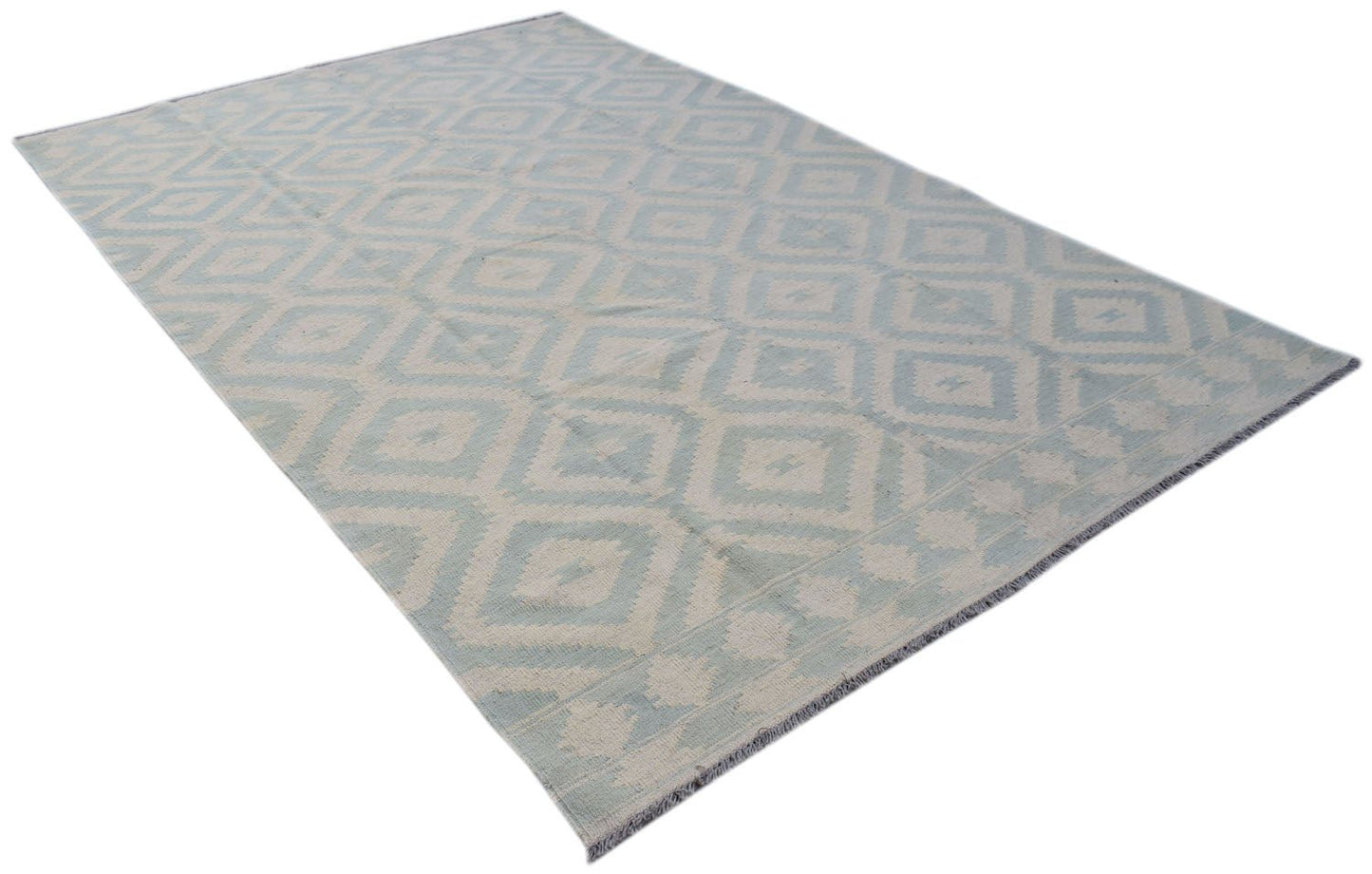 A handmade Afghan Maimana kilim rug featuring a light blue and cream geometric diamond pattern.
