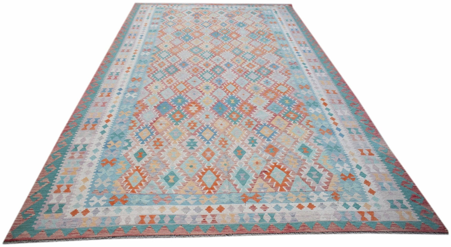 Handwoven Afghan Maimana kilim rug featuring a geometric diamond pattern in soft pastel tones.