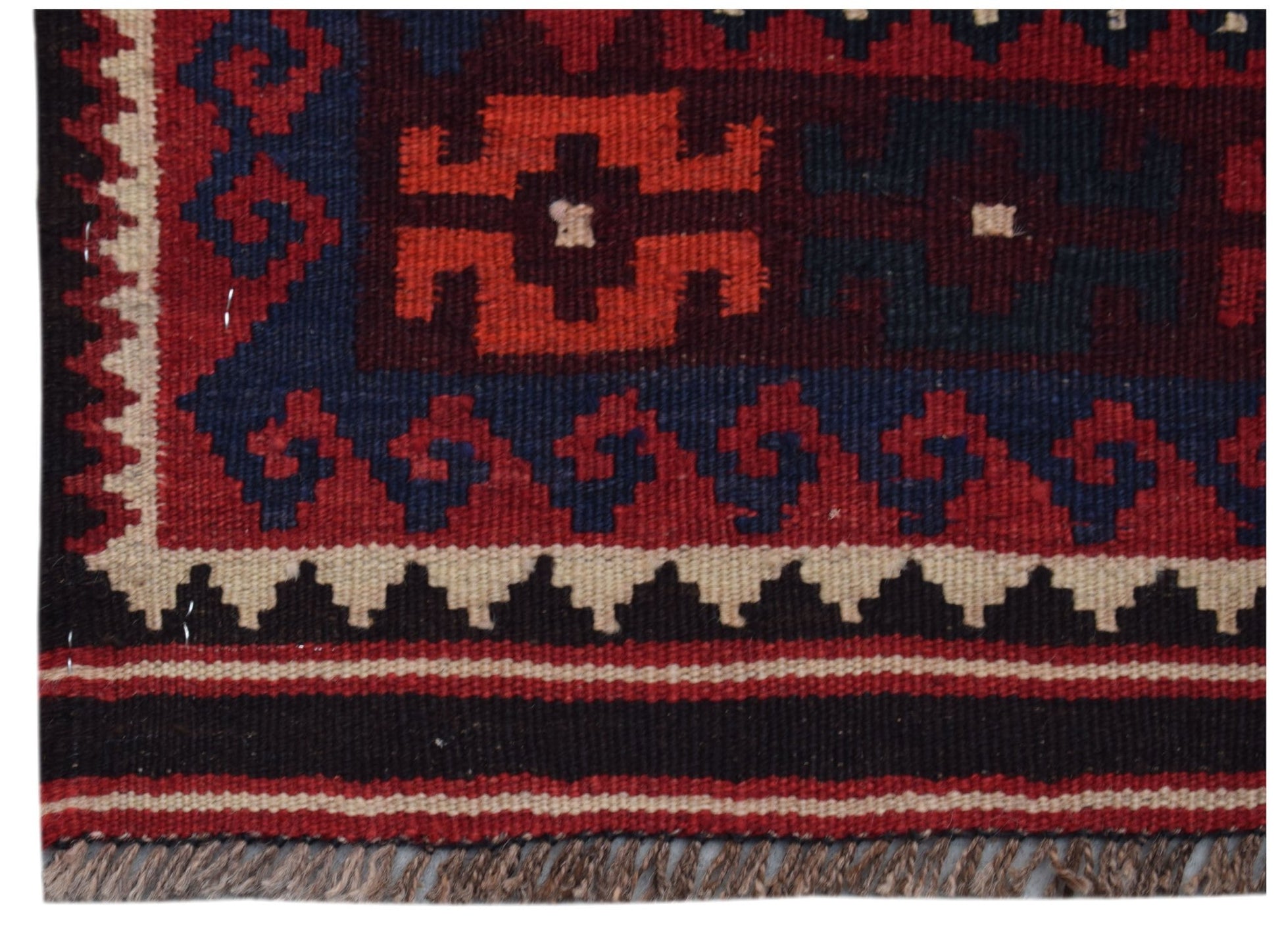 A handmade Afghan Maimana kilim runner featuring geometric patterns in red, blue, and cream wool.