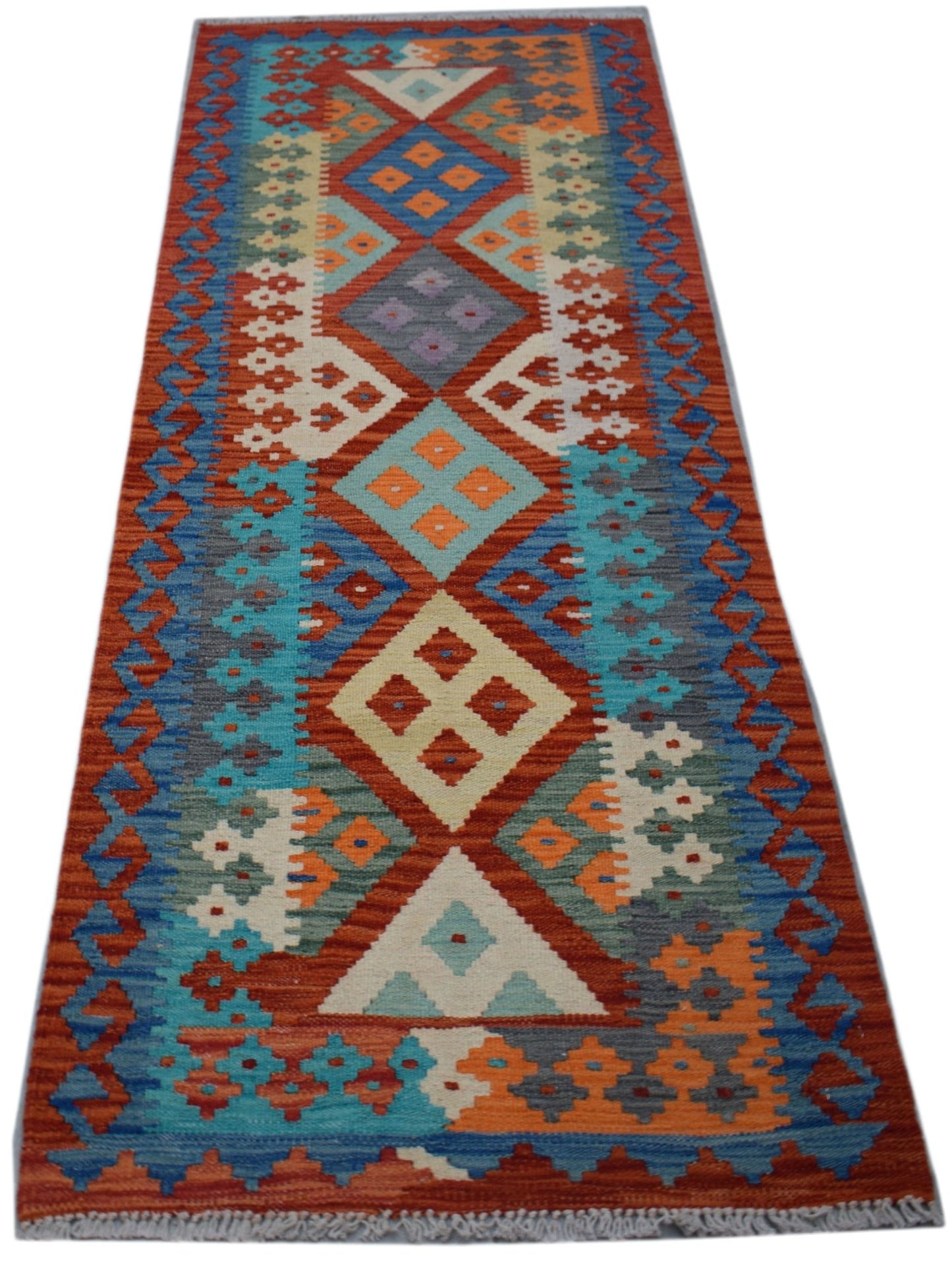 Handwoven Afghan Maimana wool runner rug featuring a colorful geometric diamond pattern.