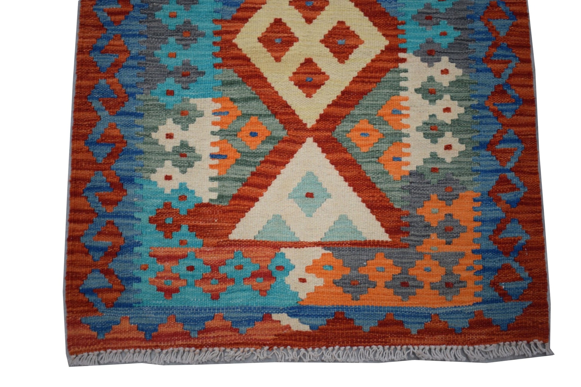 Handwoven Afghan Maimana wool runner featuring a vibrant geometric pattern in multi-colored tones.