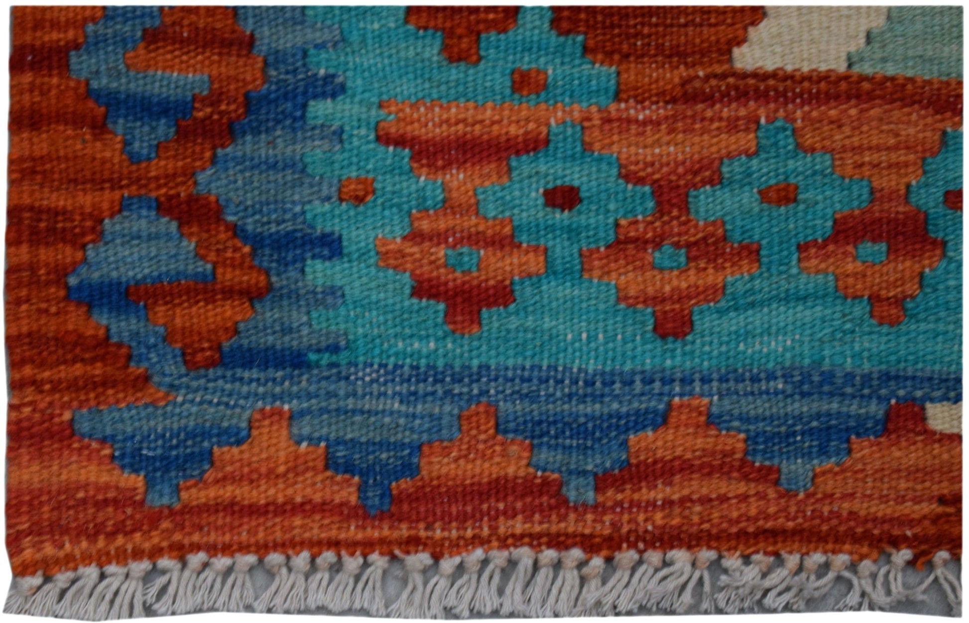 Handwoven Afghan Maimana wool kilim runner featuring a geometric pattern in orange and blue.