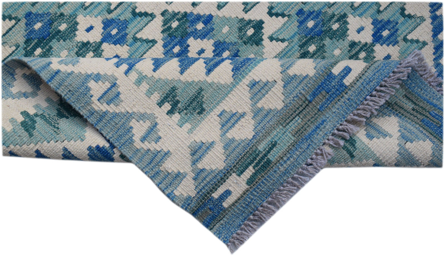 Handwoven Afghan Maimana wool kilim runner featuring a geometric pattern in shades of blue.