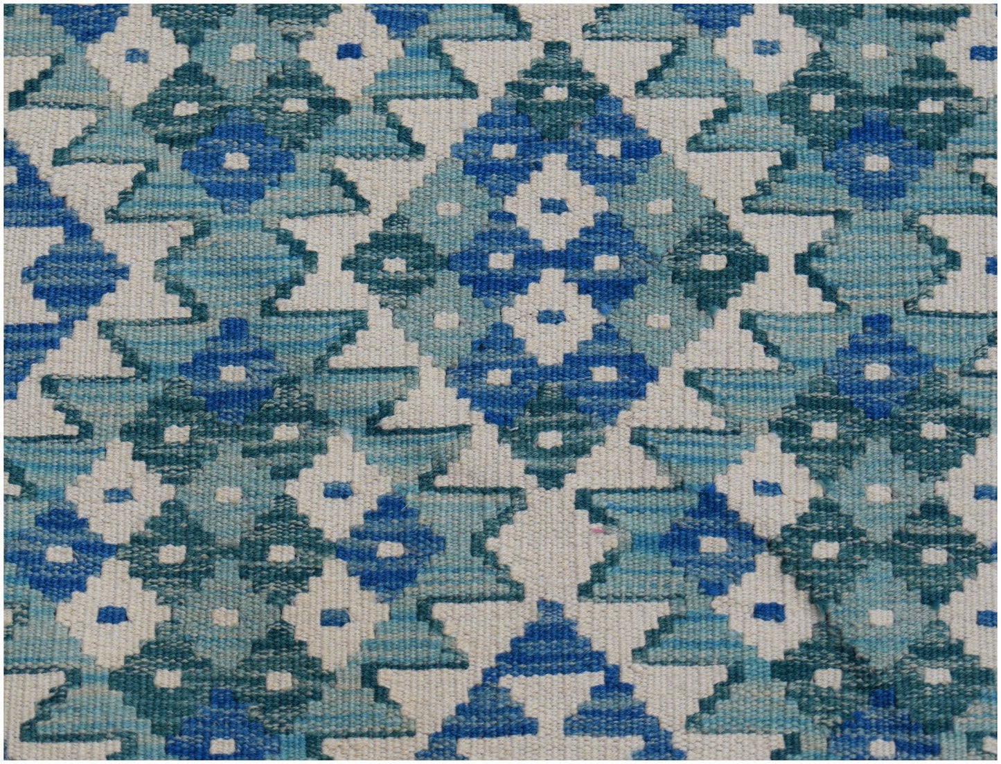 Handwoven Afghan Maimana kilim runner featuring a geometric pattern in shades of blue and white.