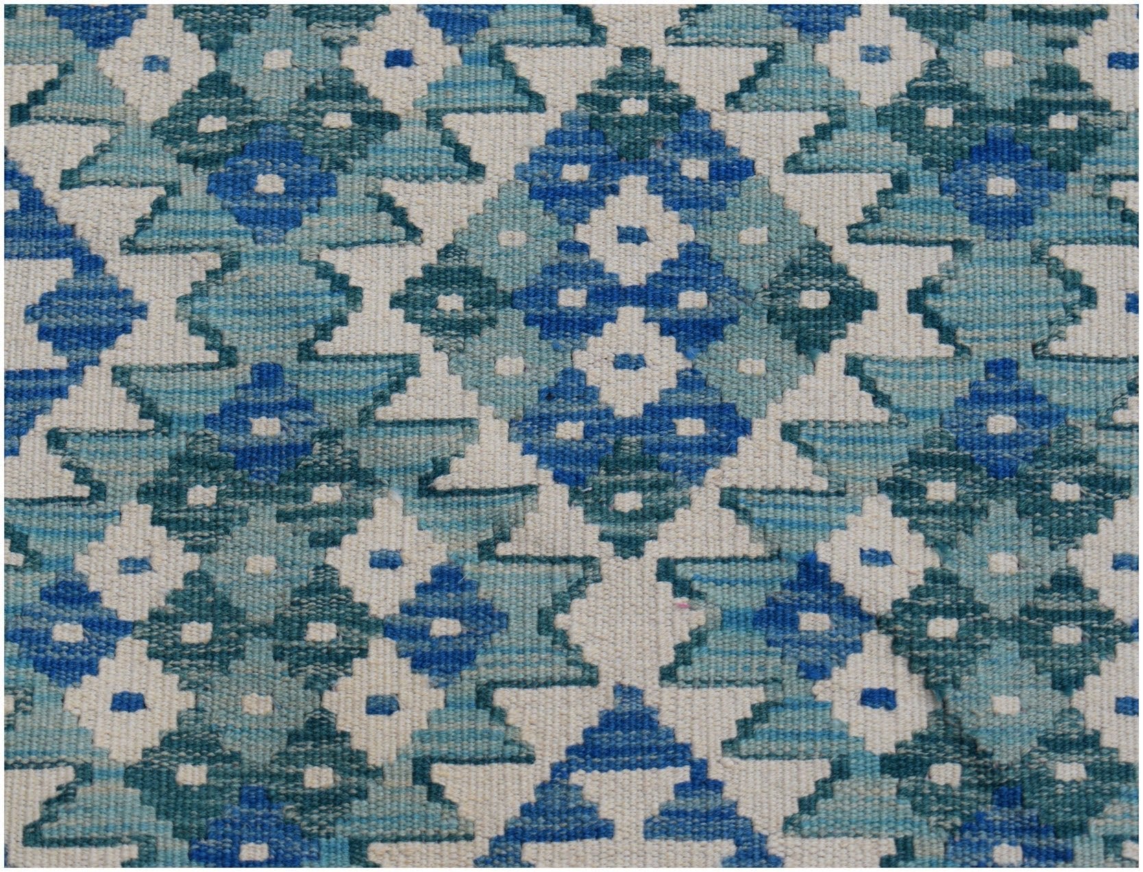 Handwoven Afghan Maimana kilim runner featuring a geometric pattern in shades of blue and white.