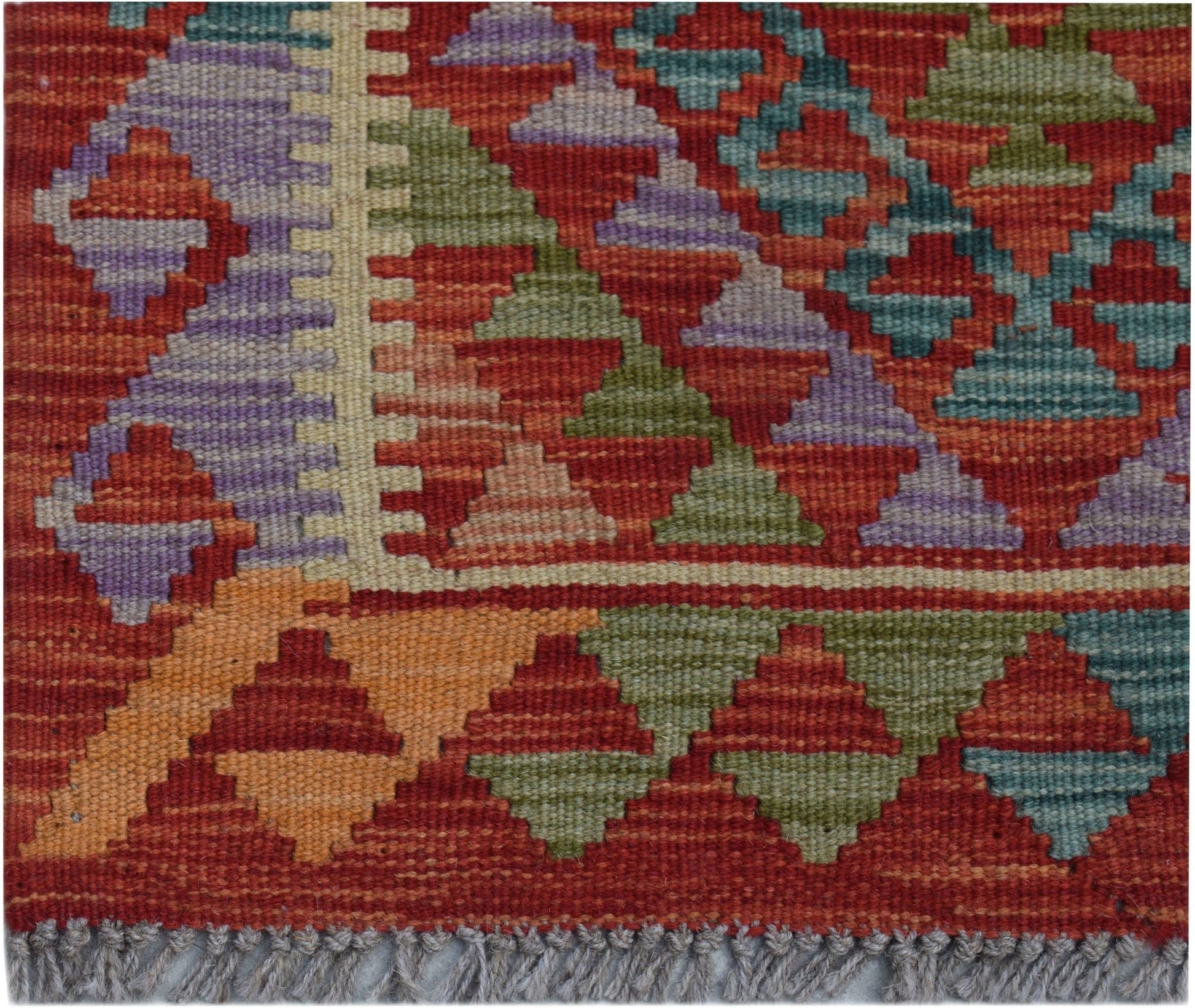 Handwoven Afghan Maimana wool kilim runner featuring a geometric pattern in vibrant colors.