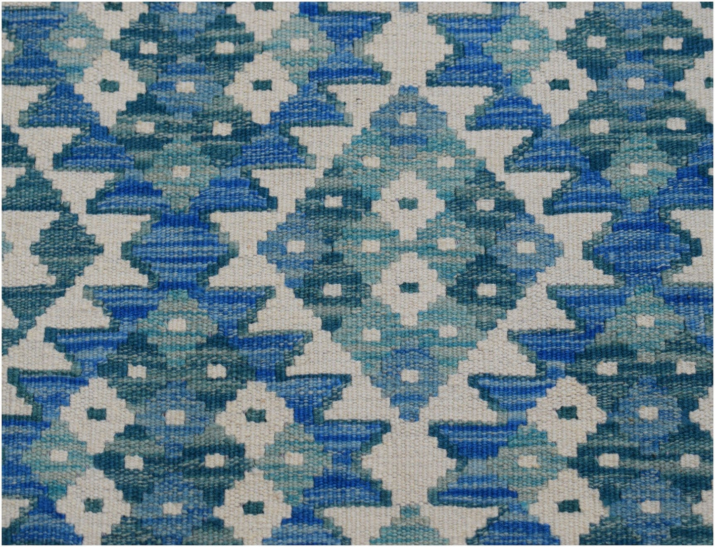 Handwoven Afghan Maimana kilim runner featuring a geometric pattern in shades of blue and cream.