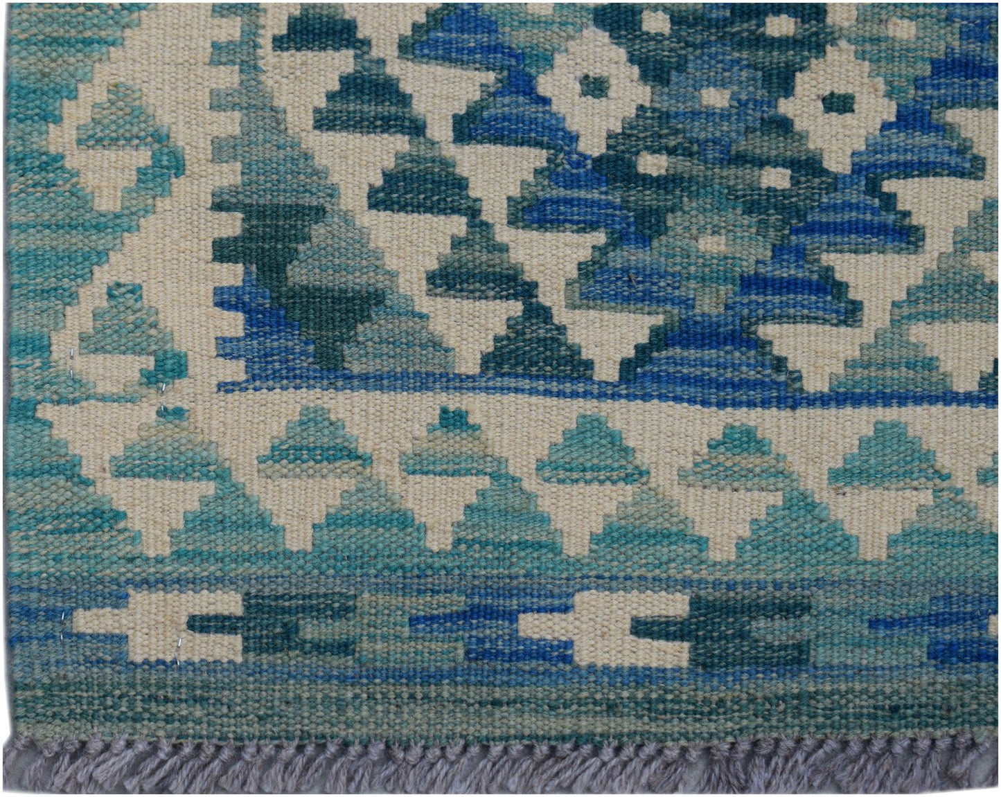 Handwoven Afghan Maimana wool runner featuring a geometric pattern in shades of blue and cream.