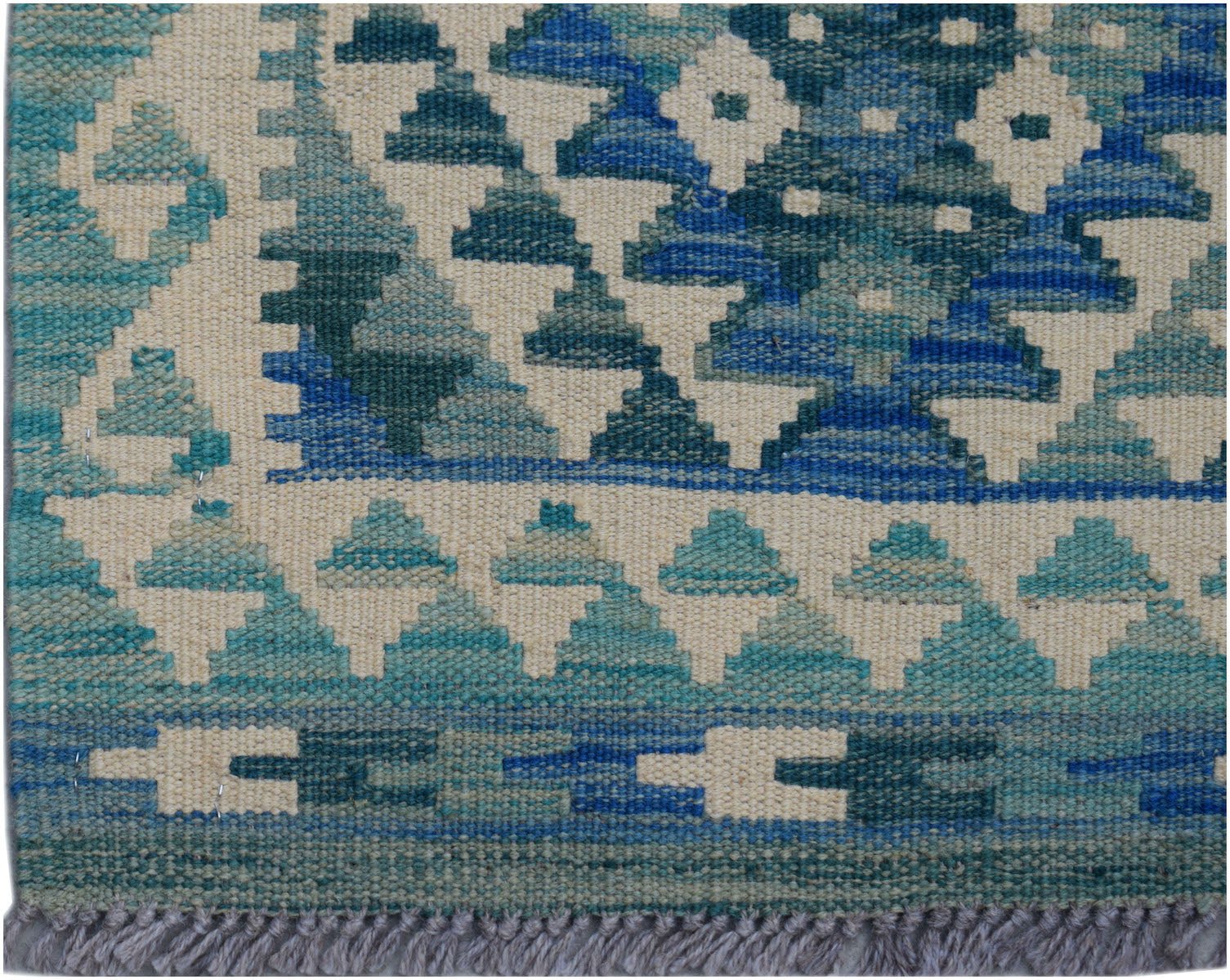 Handwoven Afghan Maimana wool runner featuring a geometric pattern in shades of blue and cream.