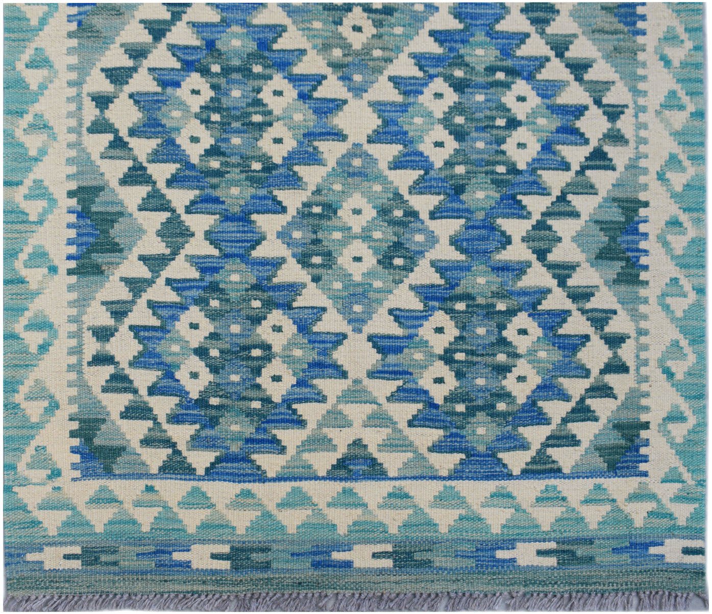 Handwoven Afghan Maimana wool runner featuring a geometric diamond pattern in shades of blue.