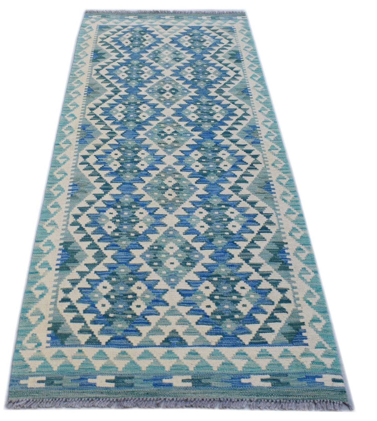A handmade Afghan Maimana wool runner rug featuring a geometric diamond pattern in shades of blue.