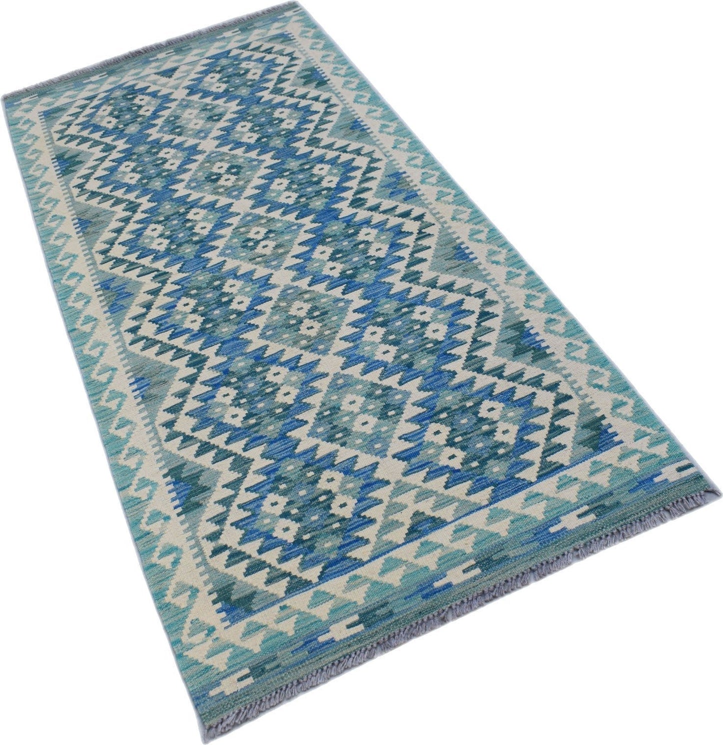 A handmade Afghan Maimana wool runner rug featuring a blue and cream geometric diamond pattern.