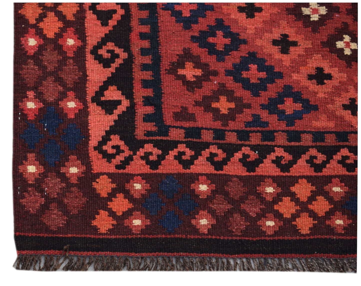 Handwoven Afghan Maimana kilim runner featuring a geometric pattern in red, black, and blue wool.