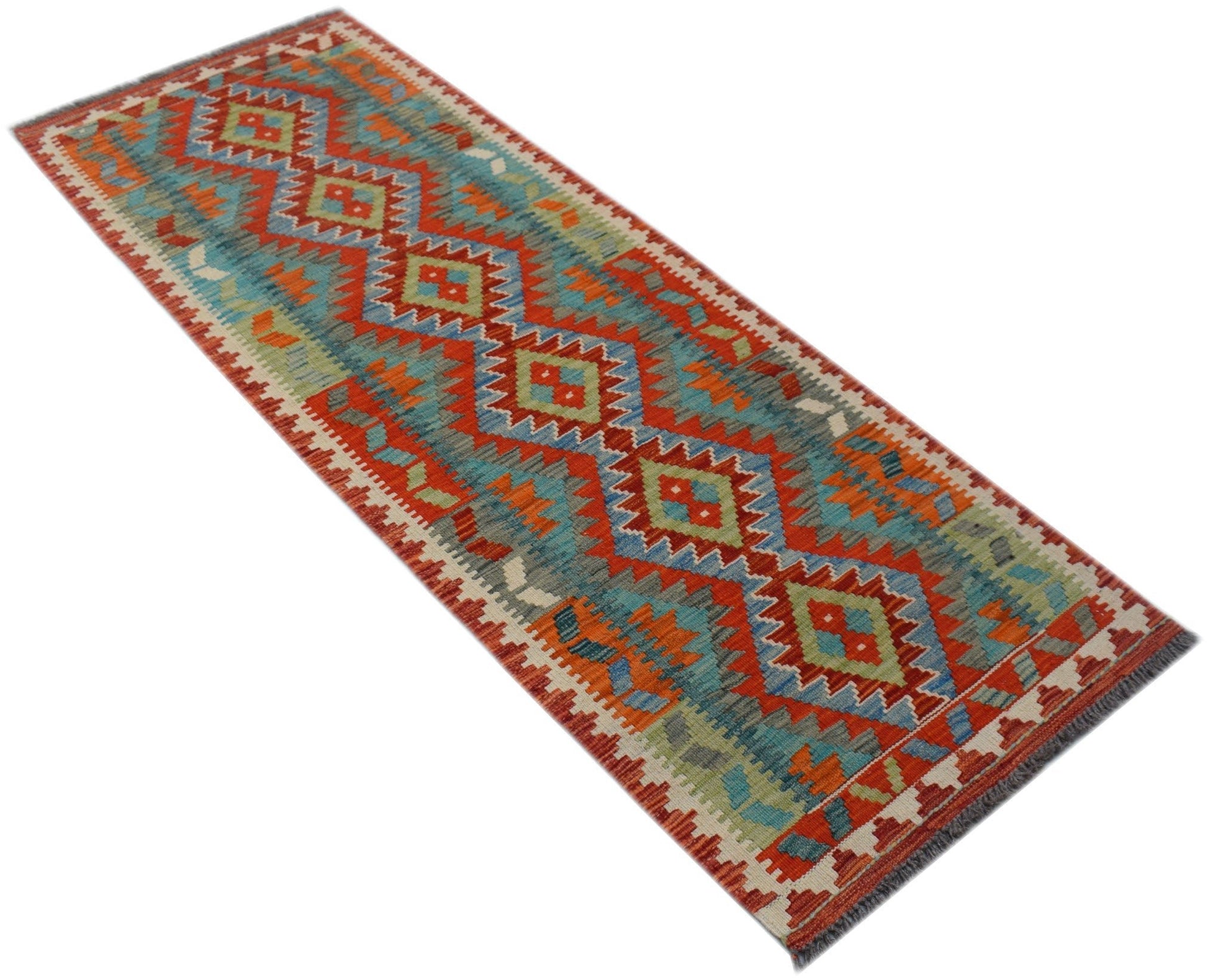 A handmade Afghan Maimana wool runner rug featuring a vibrant geometric pattern in red and blue.