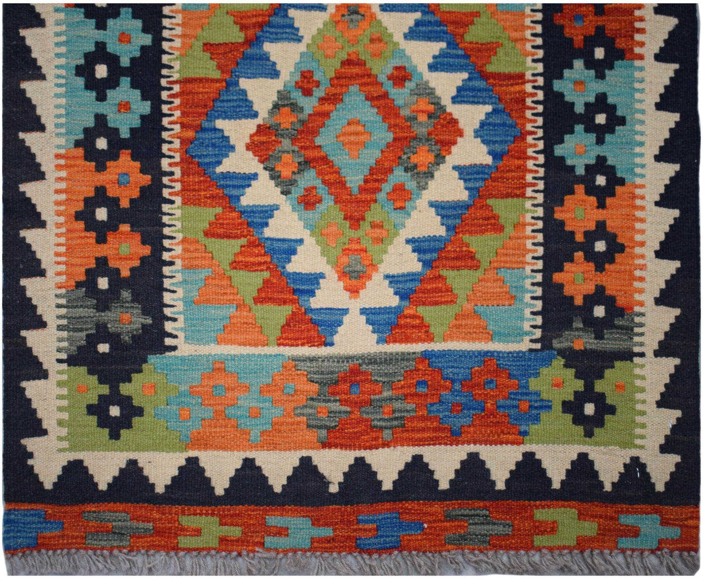 Handwoven Afghan Maimana wool runner featuring a vibrant geometric diamond pattern.