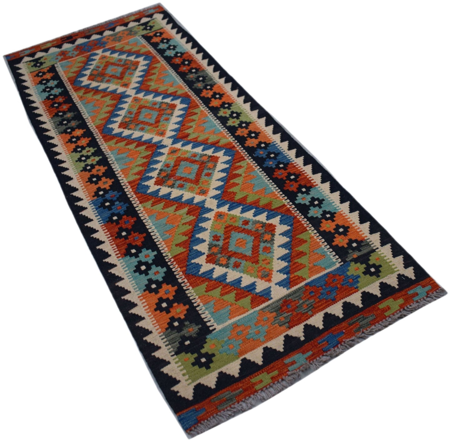 A handmade Afghan Maimana wool runner rug featuring a colorful geometric diamond pattern.
