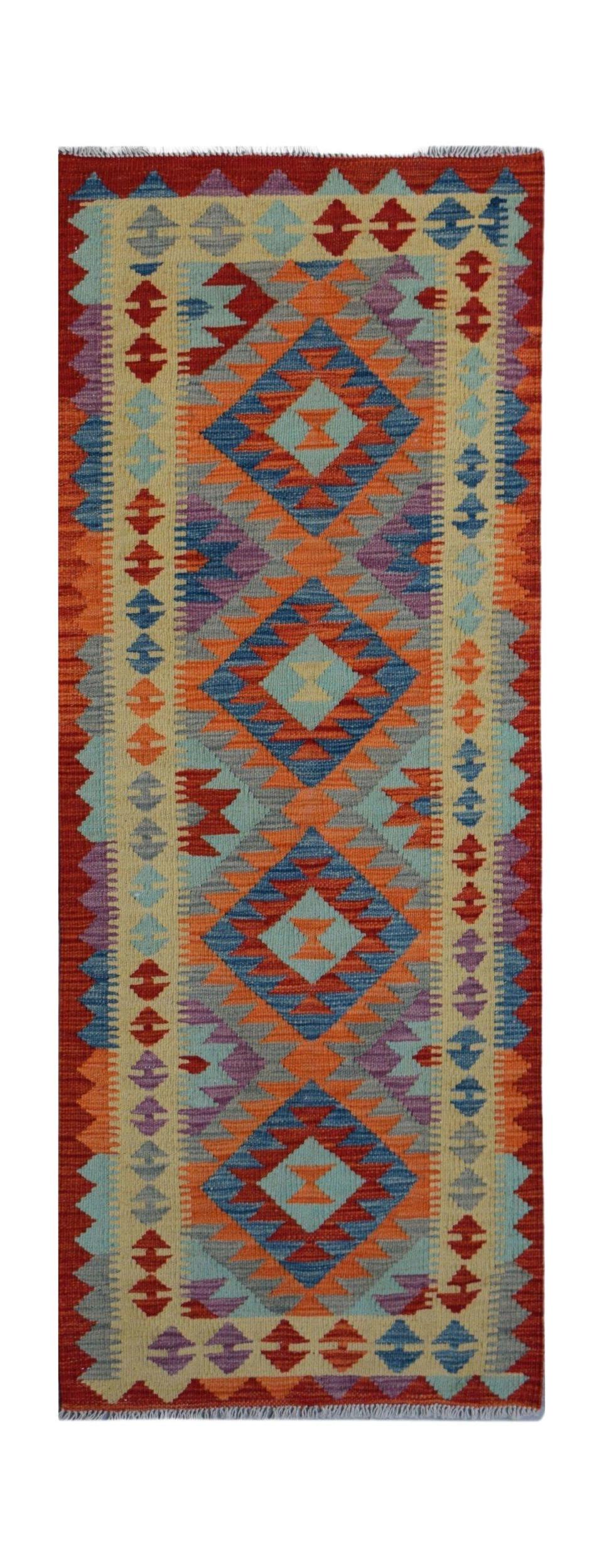 Handwoven Afghan Maimana wool runner featuring a vibrant geometric diamond pattern.