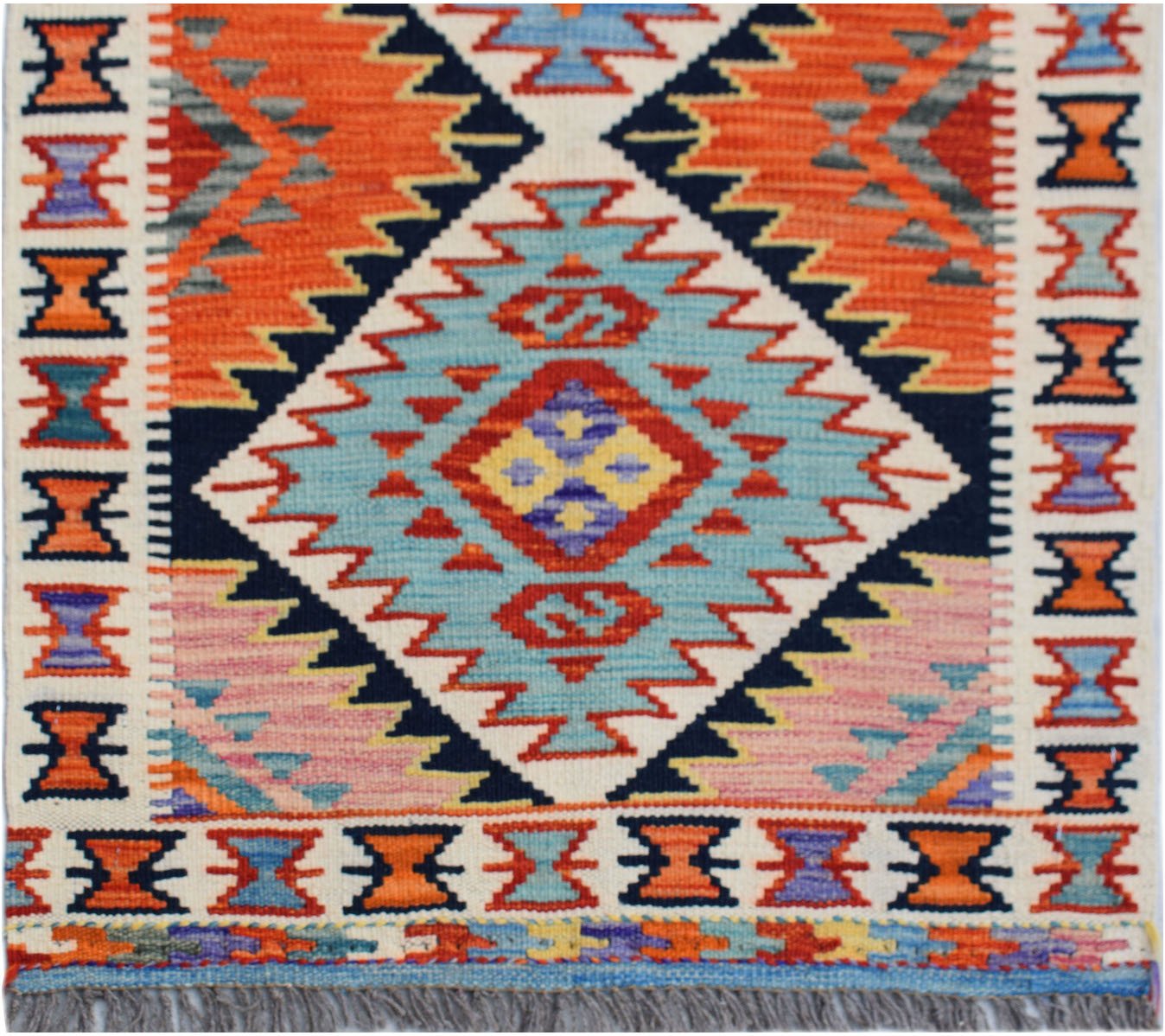Handwoven Afghan Maimana wool runner featuring a vibrant geometric diamond pattern.