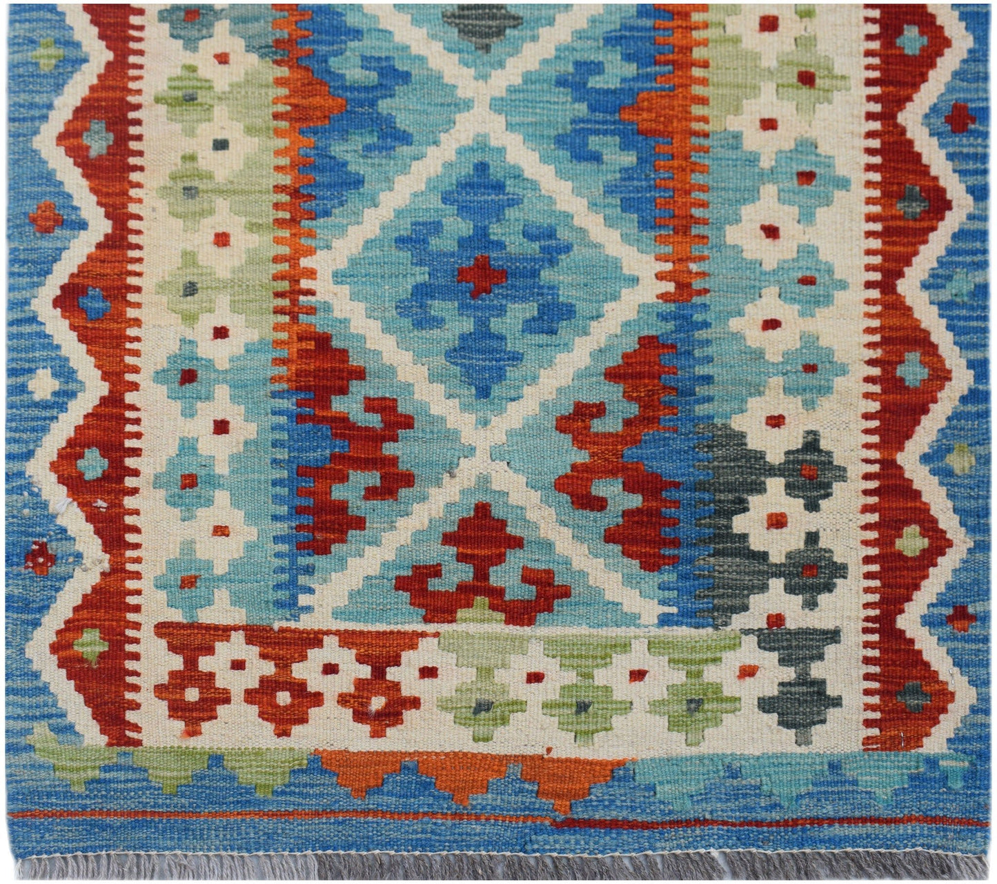 Handwoven Afghan Maimana wool runner featuring a geometric diamond pattern in blue, red, and green.