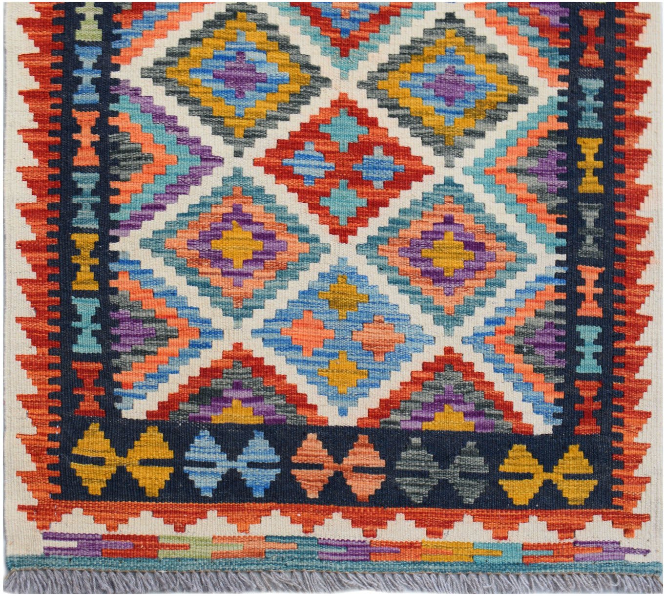 Handwoven Afghan Maimana wool runner featuring a vibrant geometric diamond pattern.