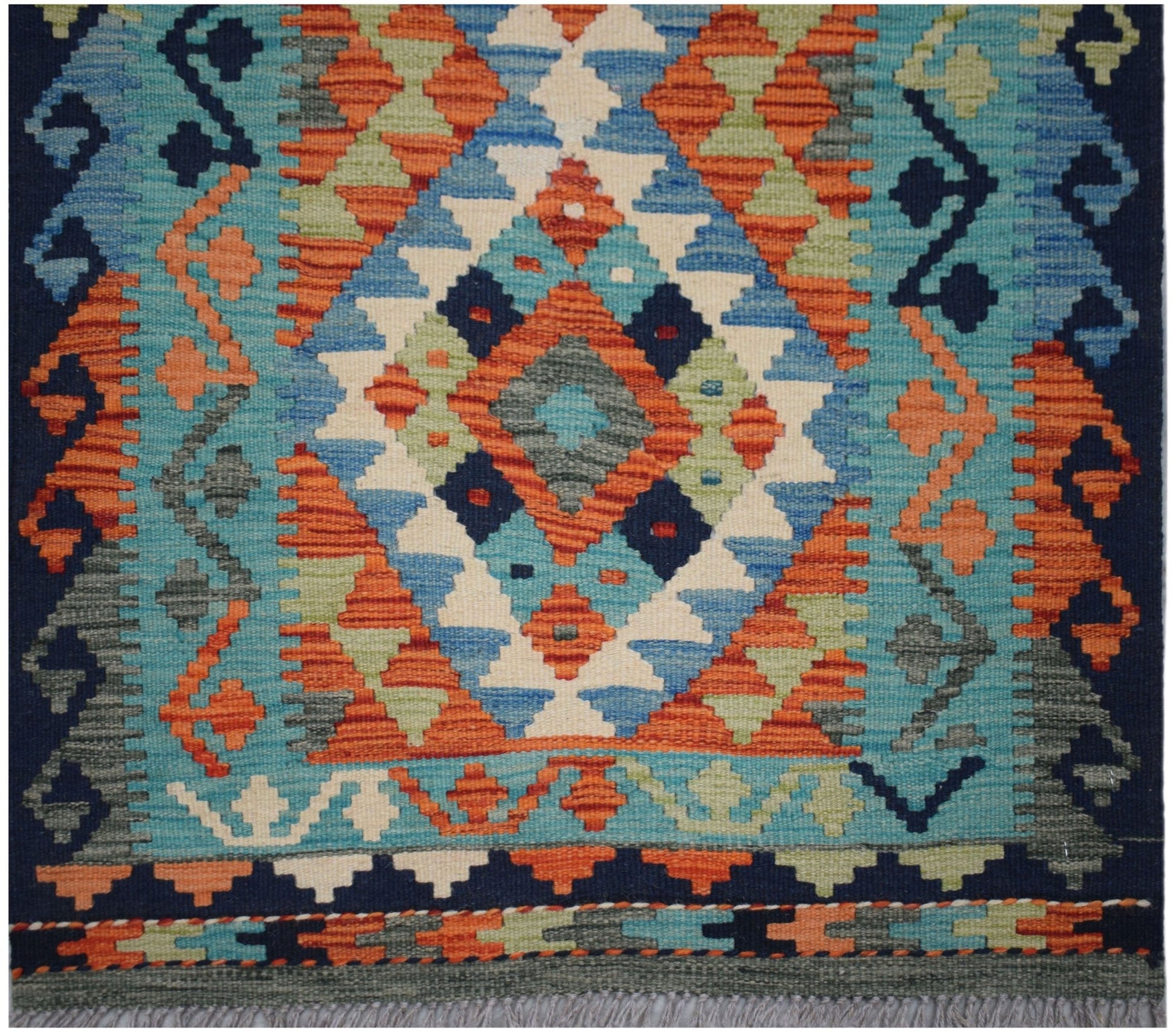 Handwoven Afghan Maimana wool runner featuring a vibrant geometric diamond pattern.