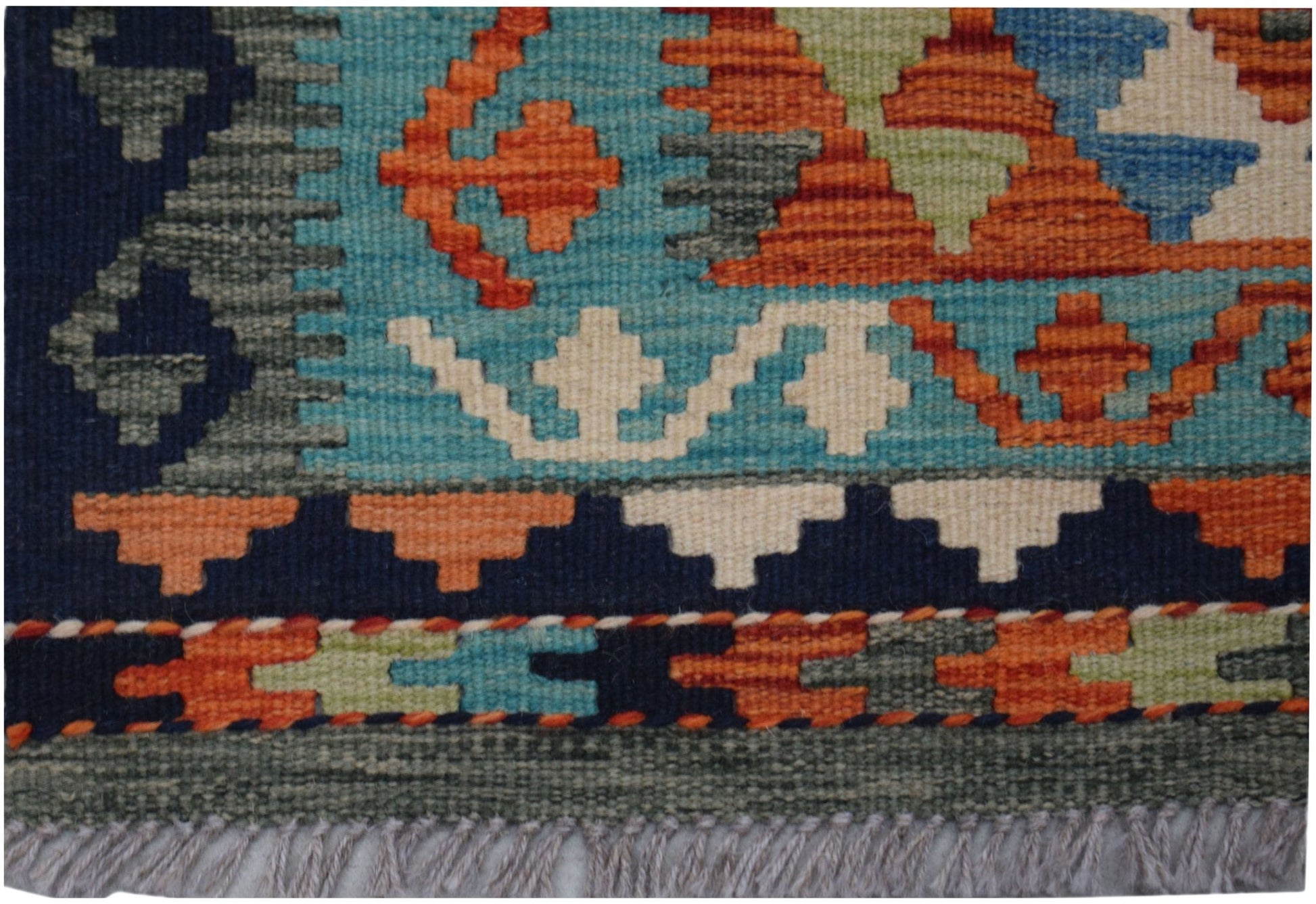 Handwoven Afghan Maimana kilim runner featuring geometric patterns in vibrant wool colors.