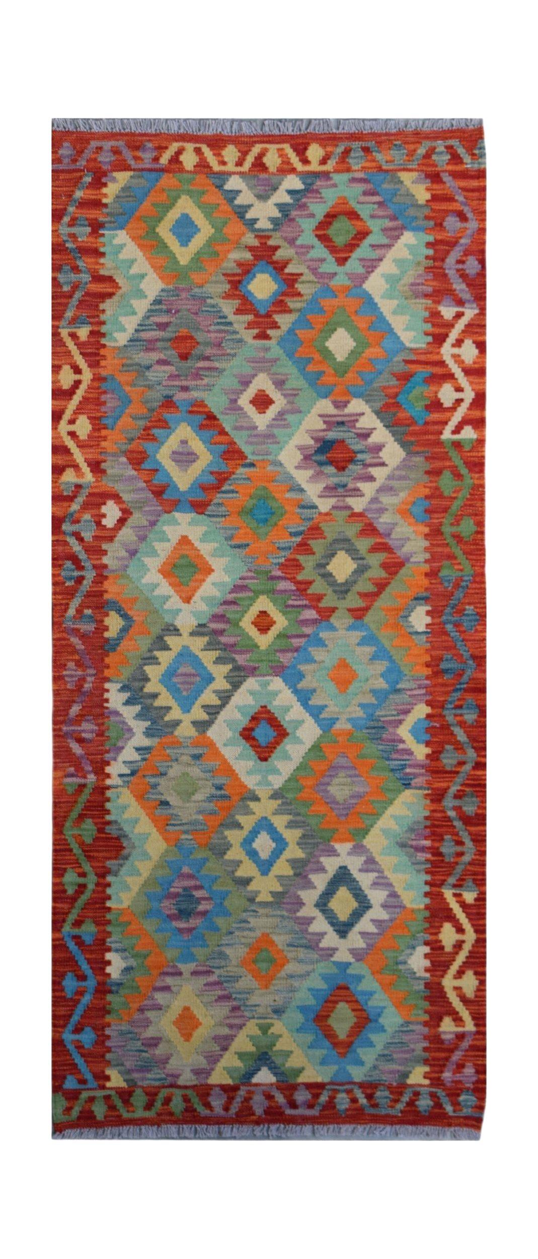 Handwoven Afghan Maimana wool runner rug featuring a colorful geometric diamond pattern.
