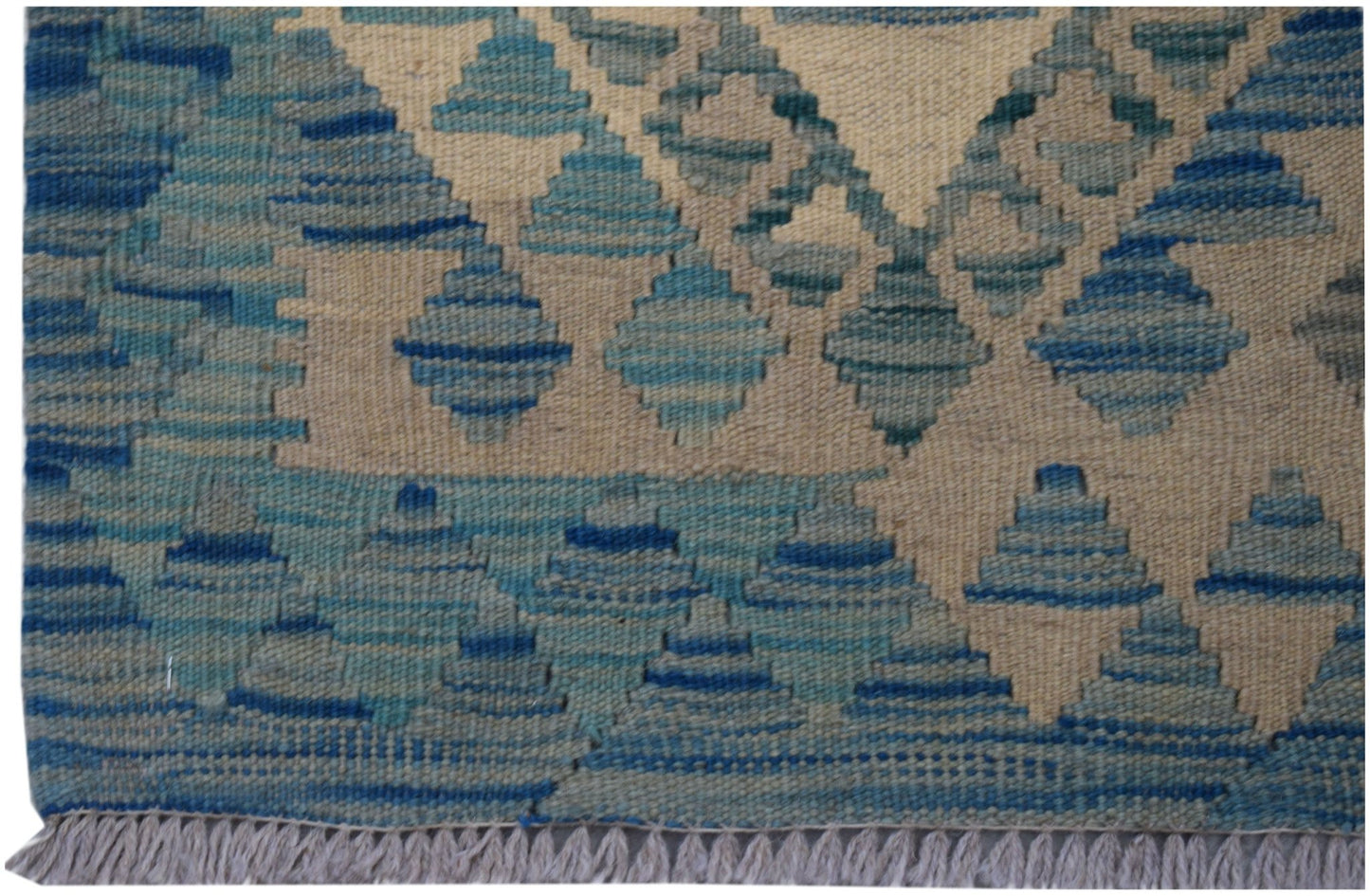 Handwoven Afghan Maimana wool runner featuring a geometric blue and cream diamond pattern.