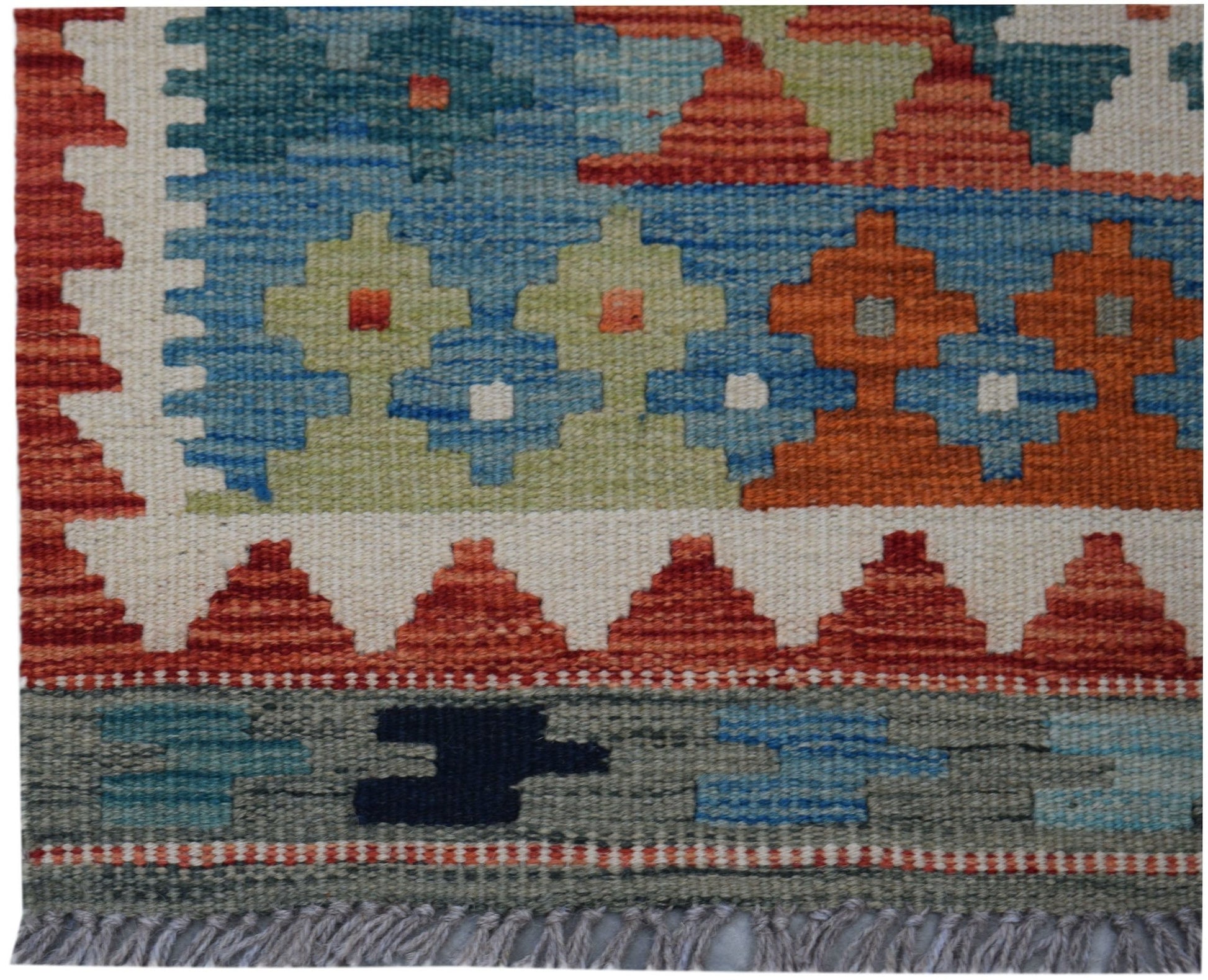 Handwoven Afghan Maimana kilim runner featuring geometric patterns in blue, orange, and green.
