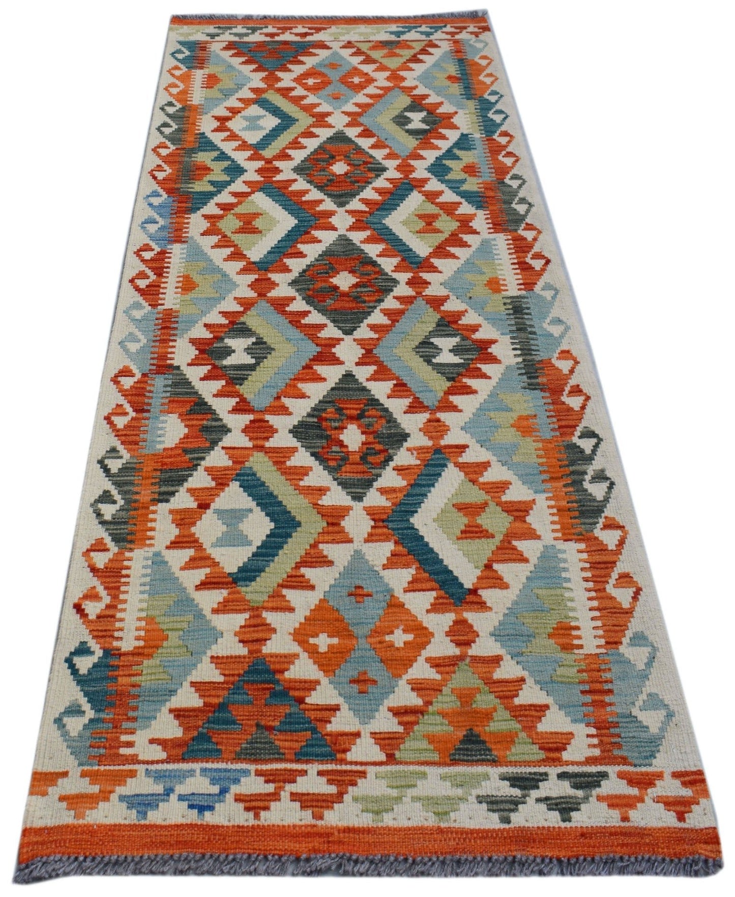 Handwoven Afghan Maimana wool runner rug featuring a colorful geometric diamond pattern.