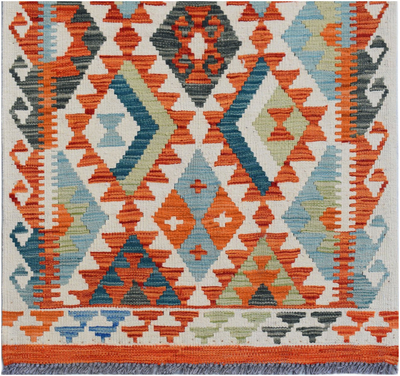 Handwoven Afghan Maimana kilim runner featuring a geometric diamond pattern in orange and blue.