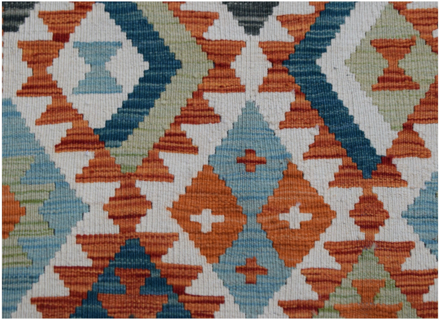 Handwoven Afghan Maimana wool kilim runner featuring a geometric diamond pattern in vibrant colors.