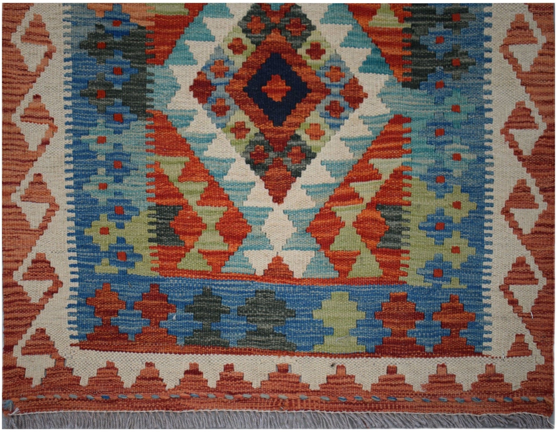 Handwoven Afghan Maimana kilim runner featuring a geometric diamond pattern in vibrant colors.
