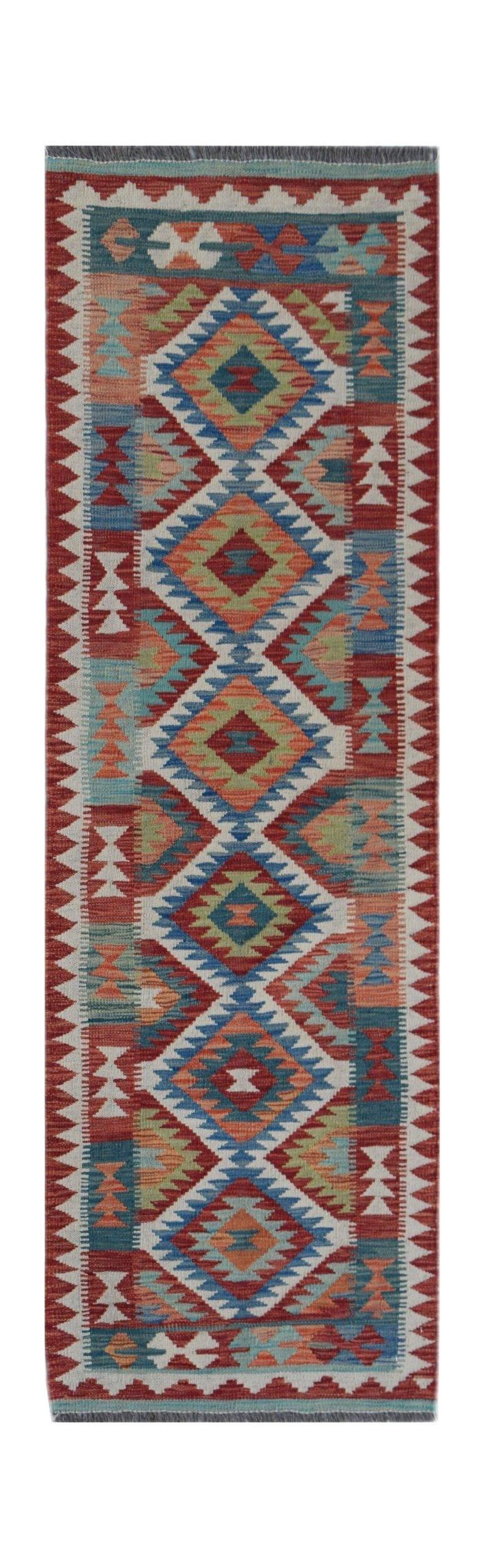 Handwoven Afghan Maimana wool runner rug featuring a colorful geometric diamond pattern.