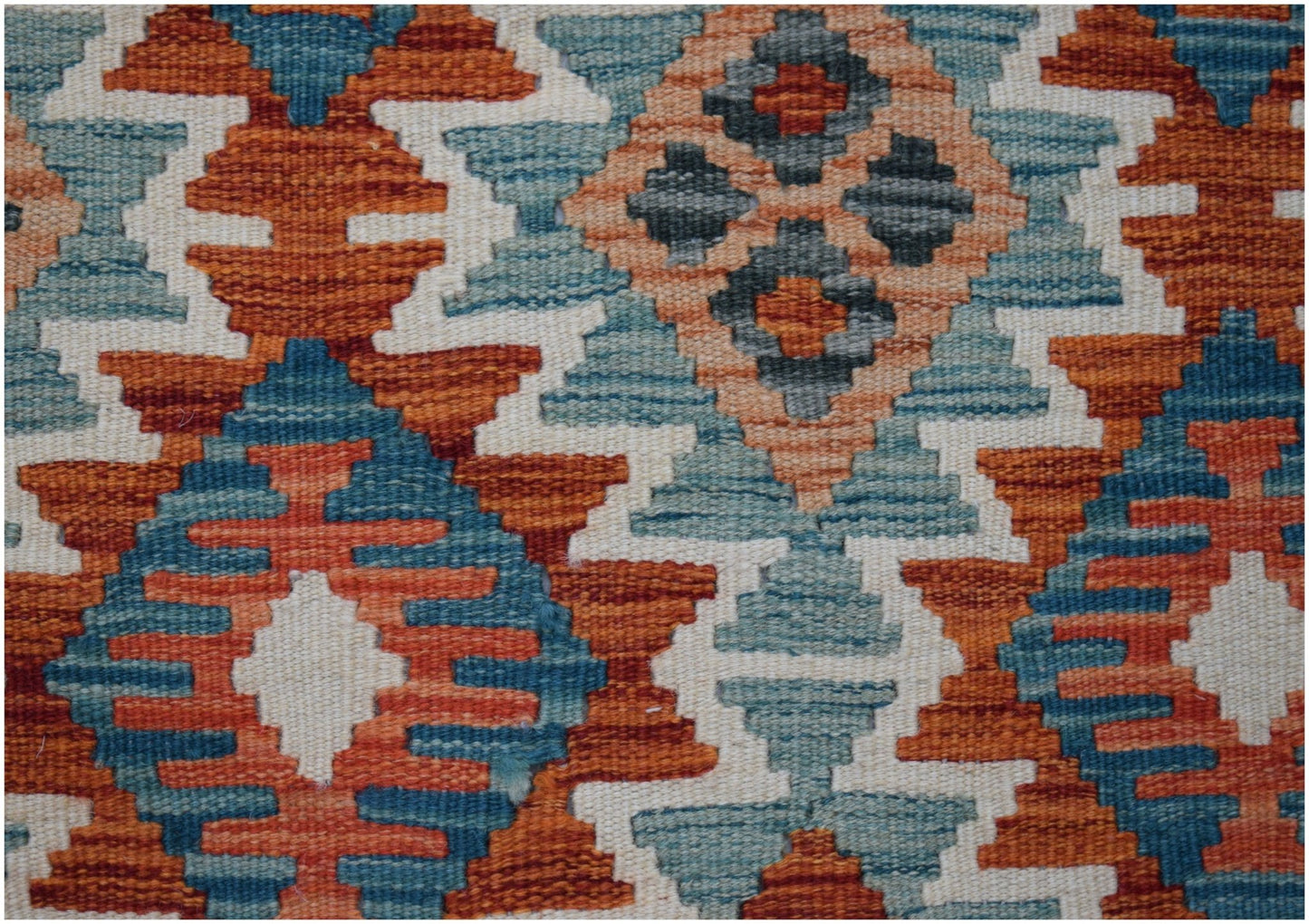 Handwoven Afghan Maimana kilim runner featuring a geometric pattern in orange, blue, and cream.