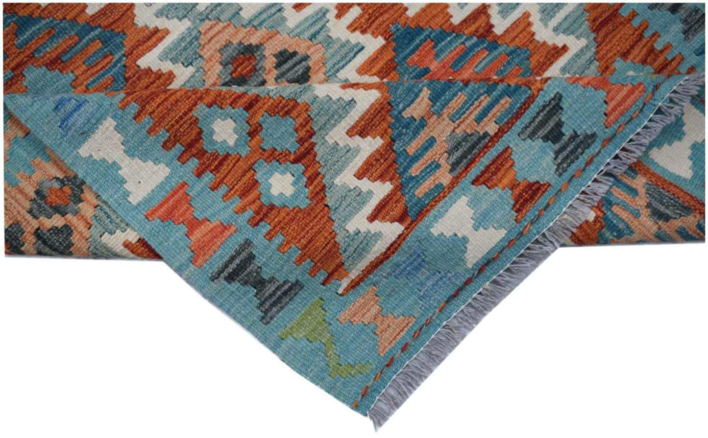 A handwoven Afghan Maimana Kilim runner featuring geometric patterns in orange, blue, and white.
