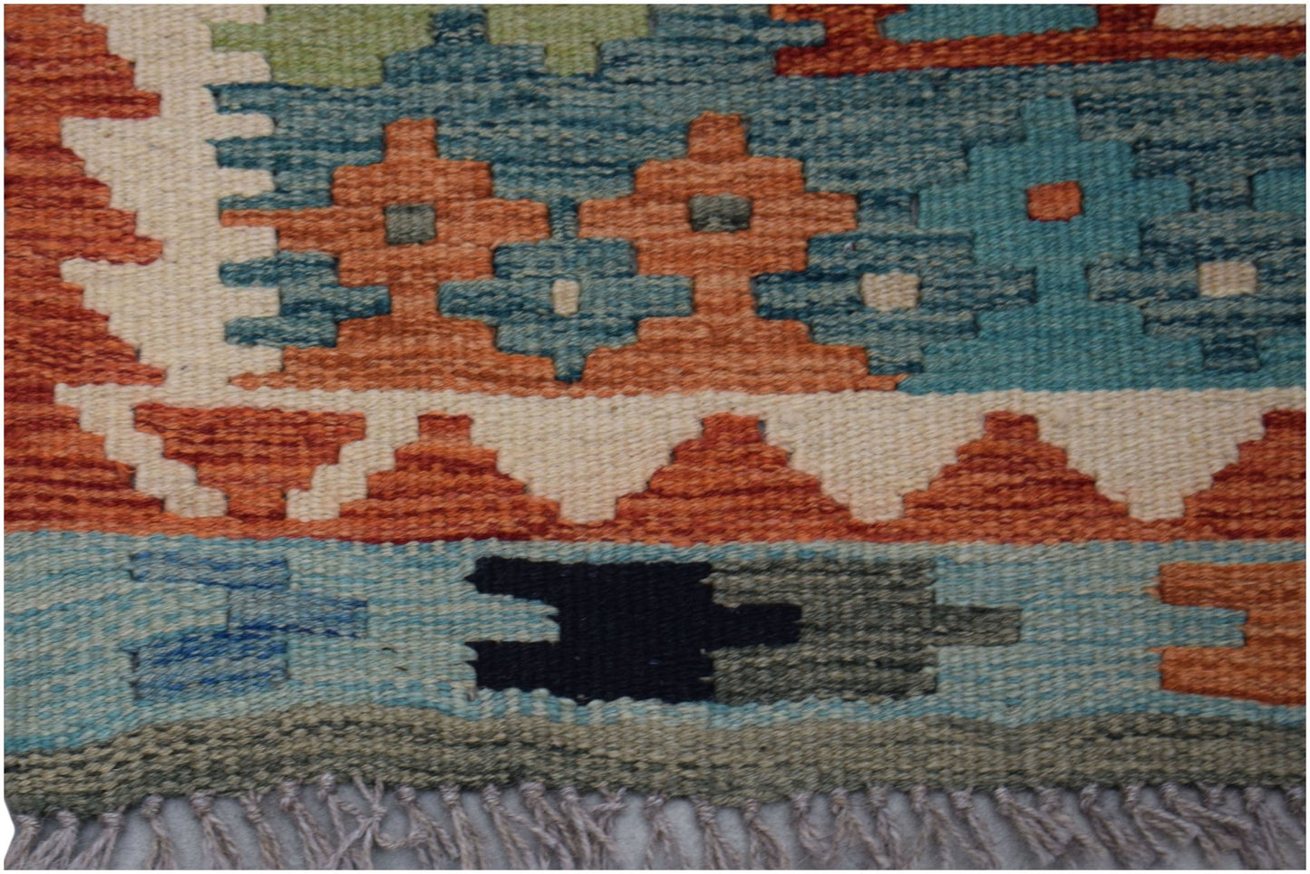 Handwoven Afghan Maimana wool kilim runner featuring geometric patterns in blue, orange, and cream.