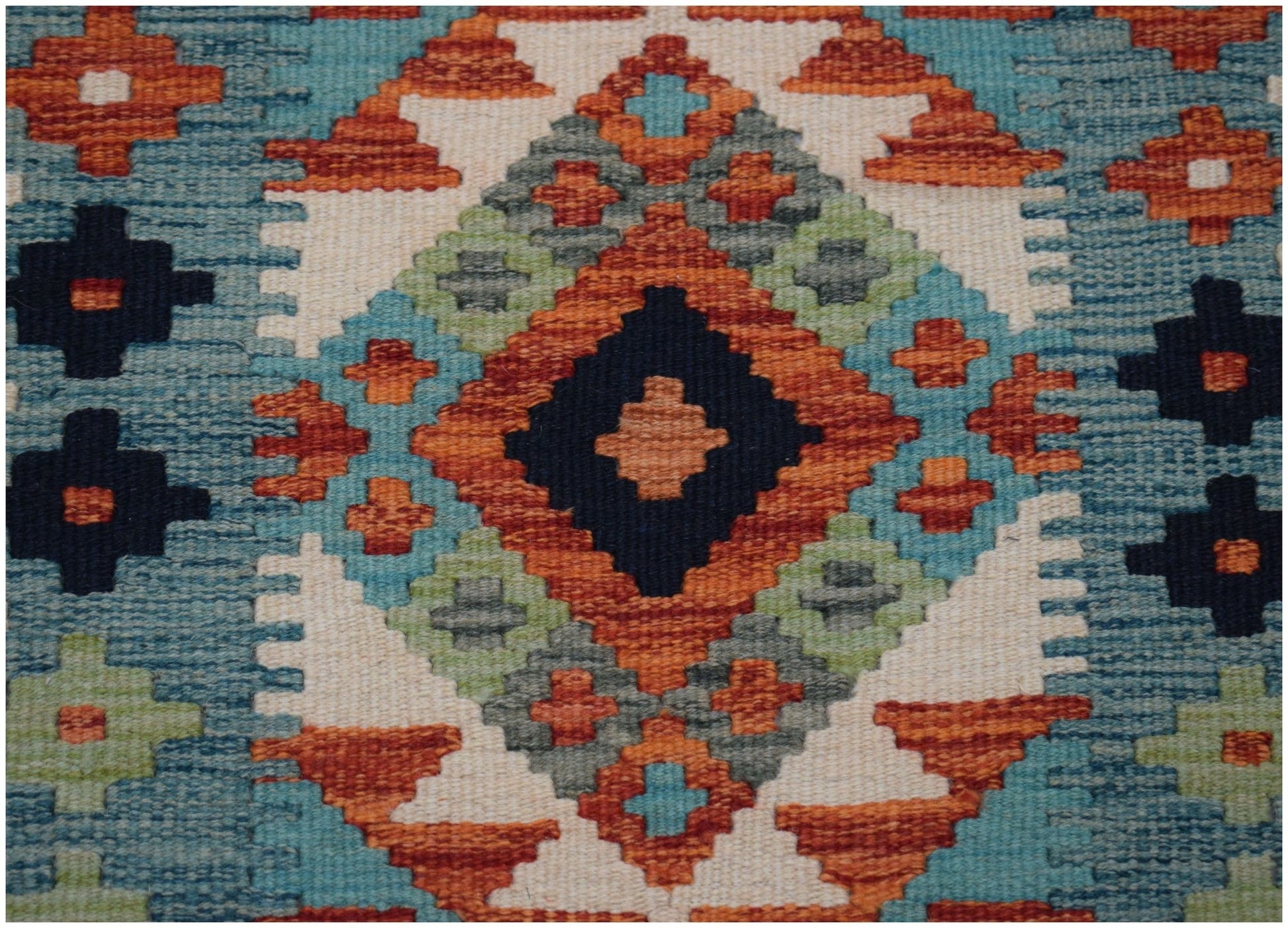 Handwoven Afghan Maimana wool runner featuring a geometric diamond pattern in blue and orange.