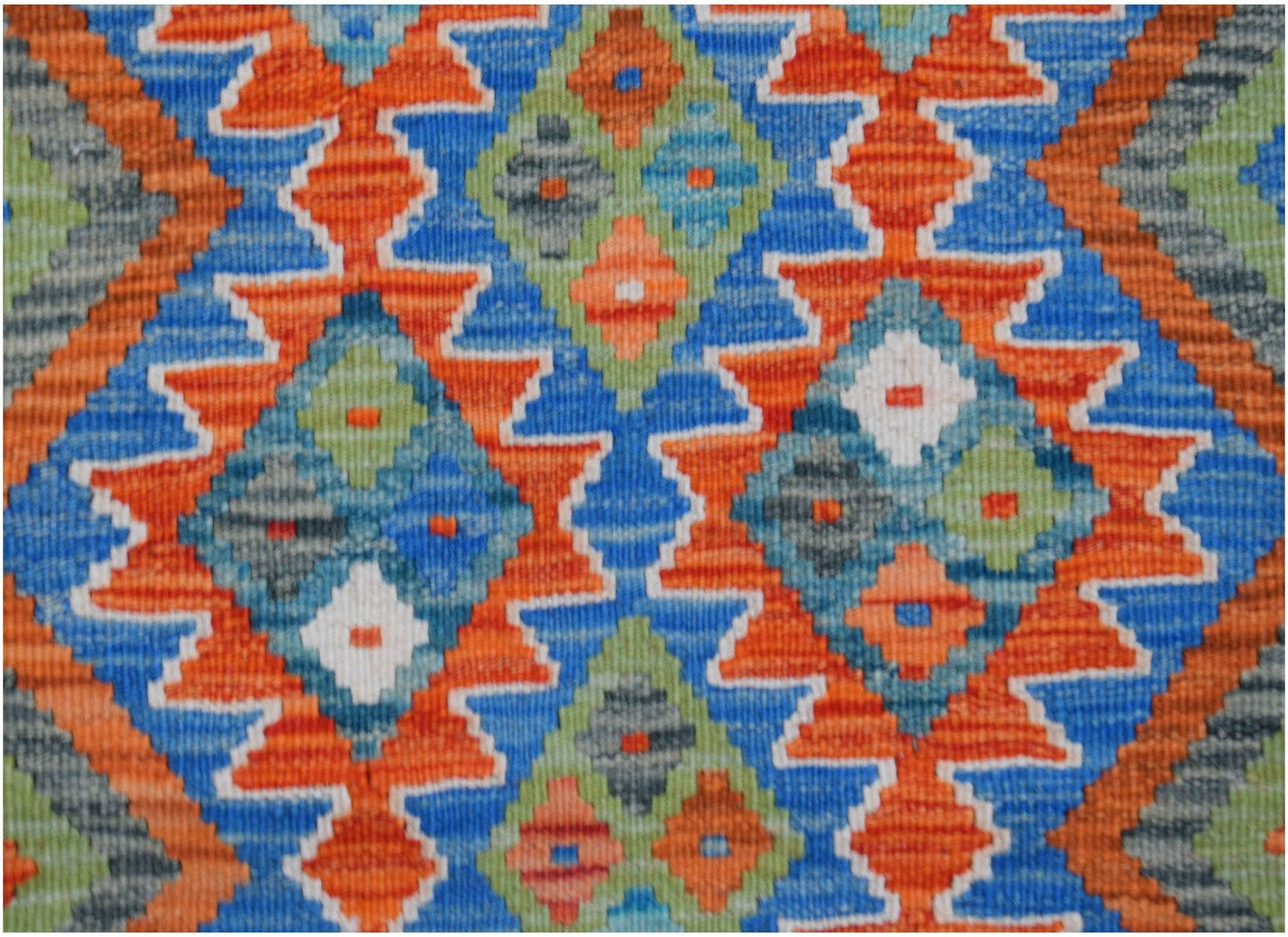 Handwoven Afghan Maimana wool kilim runner featuring a vibrant geometric diamond pattern.