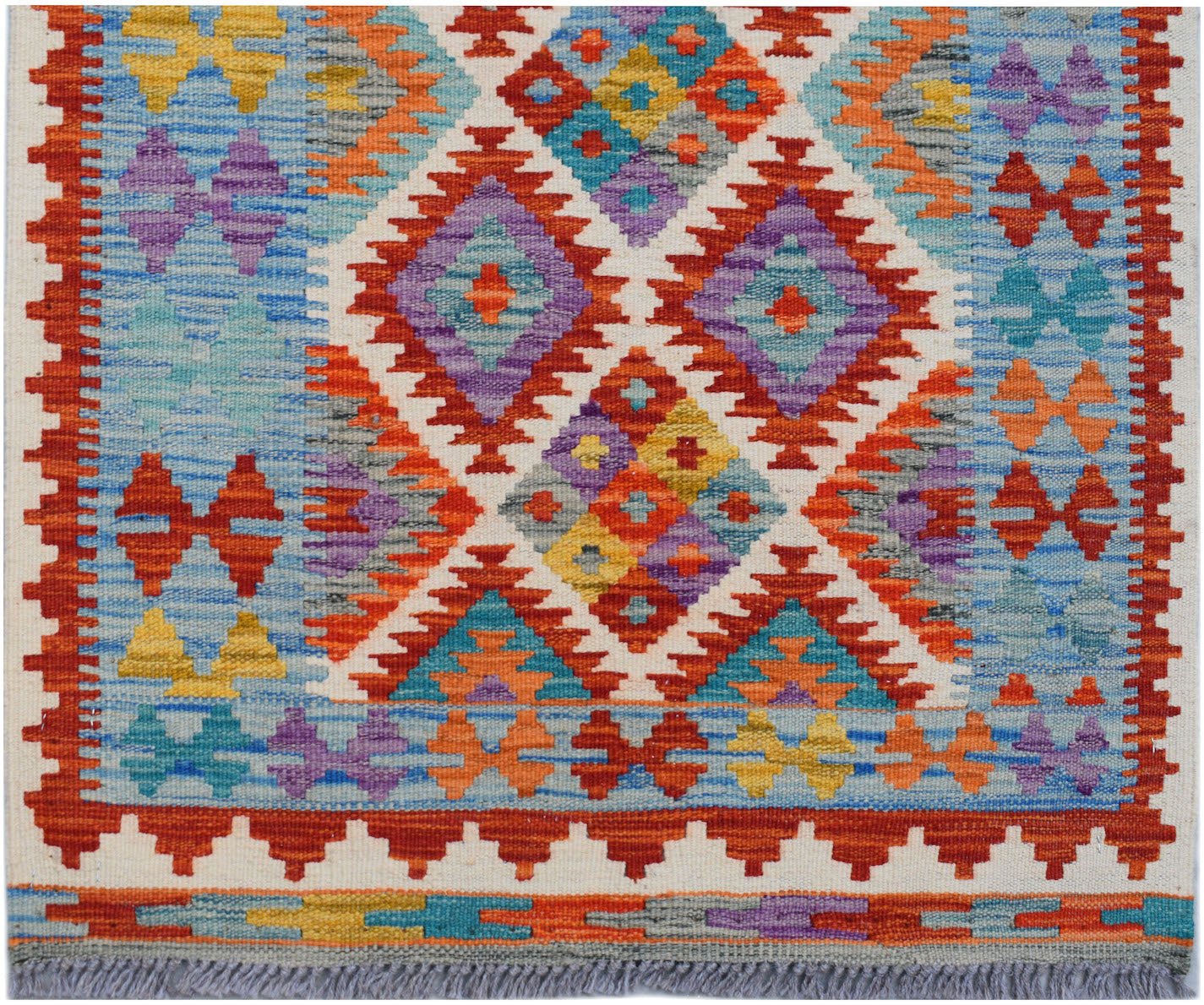Handwoven Afghan Maimana wool runner featuring a colorful geometric diamond pattern.