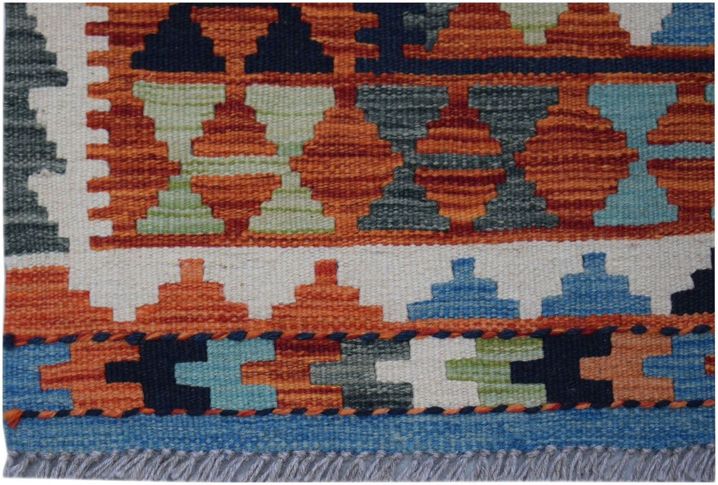 Handwoven Afghan Maimana wool kilim runner featuring a geometric pattern in vibrant colors.