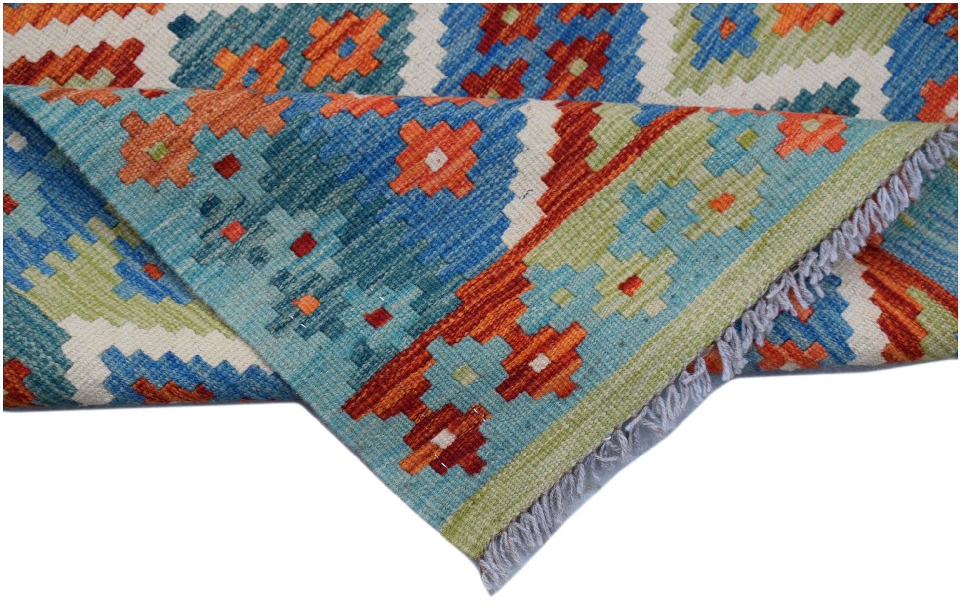 A handwoven Afghan Maimana wool kilim runner featuring a colorful geometric pattern.