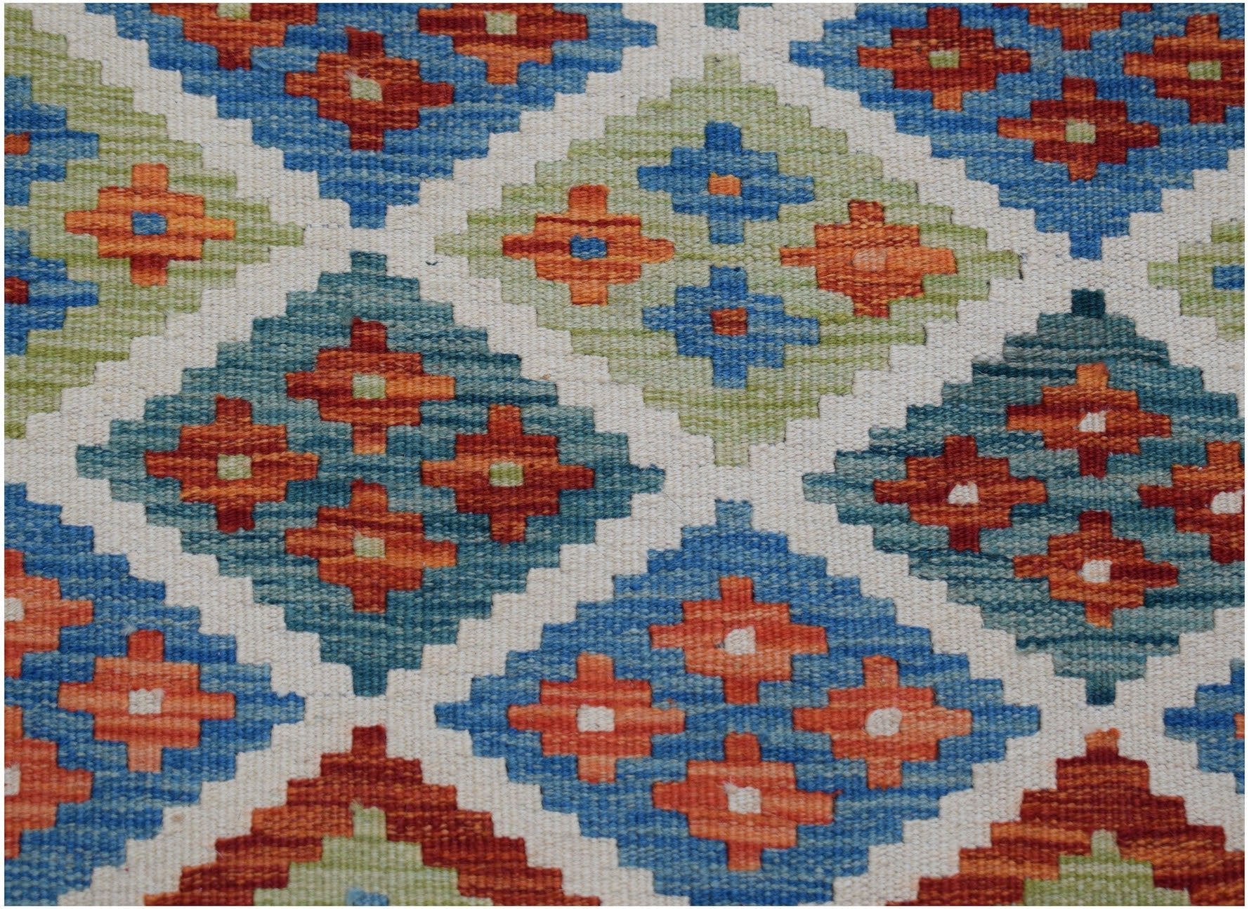 Handwoven Afghan Maimana kilim runner featuring a geometric diamond pattern in blue, orange, and green.
