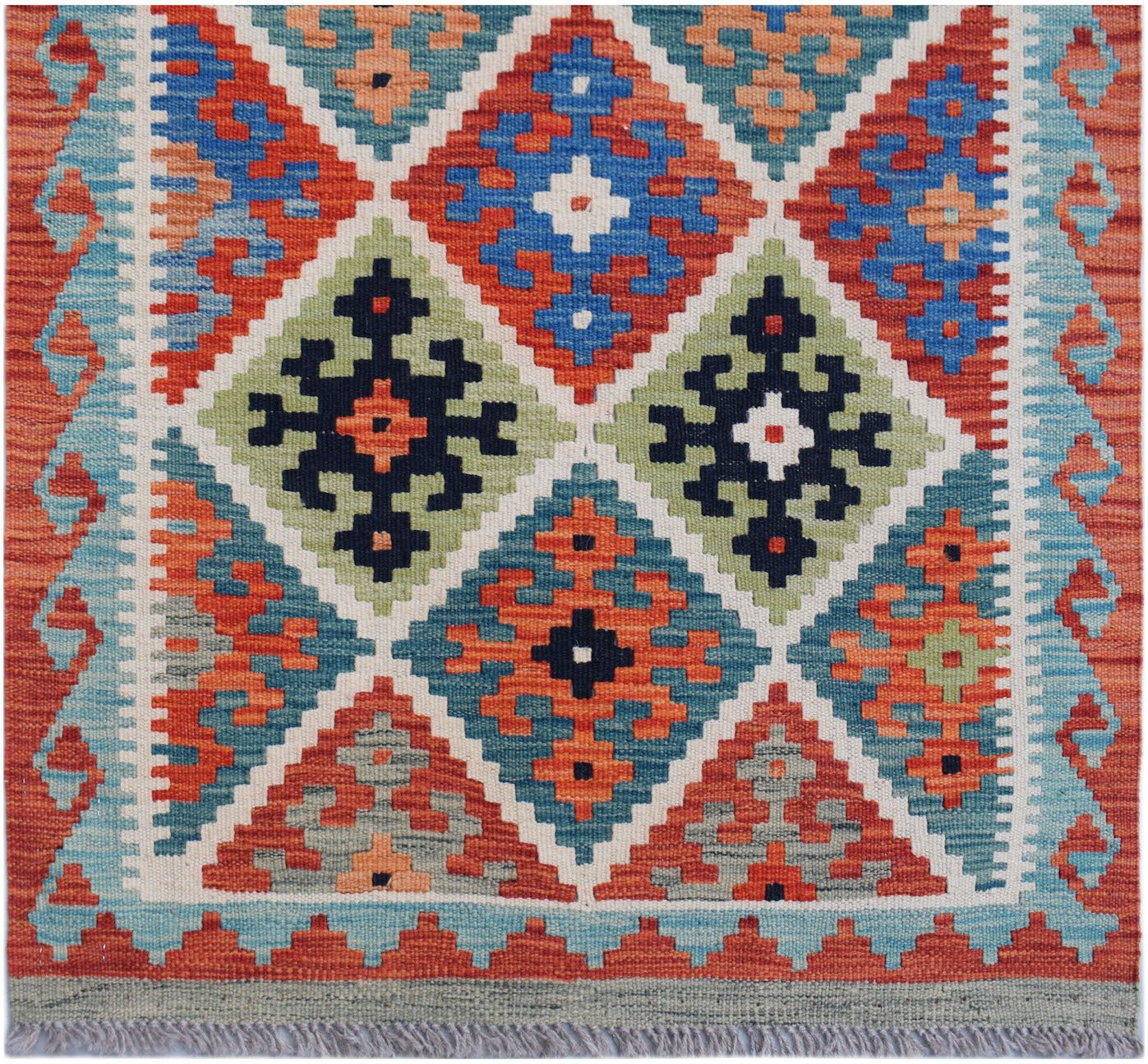 Handwoven Afghan Maimana wool runner featuring a colorful geometric diamond pattern.