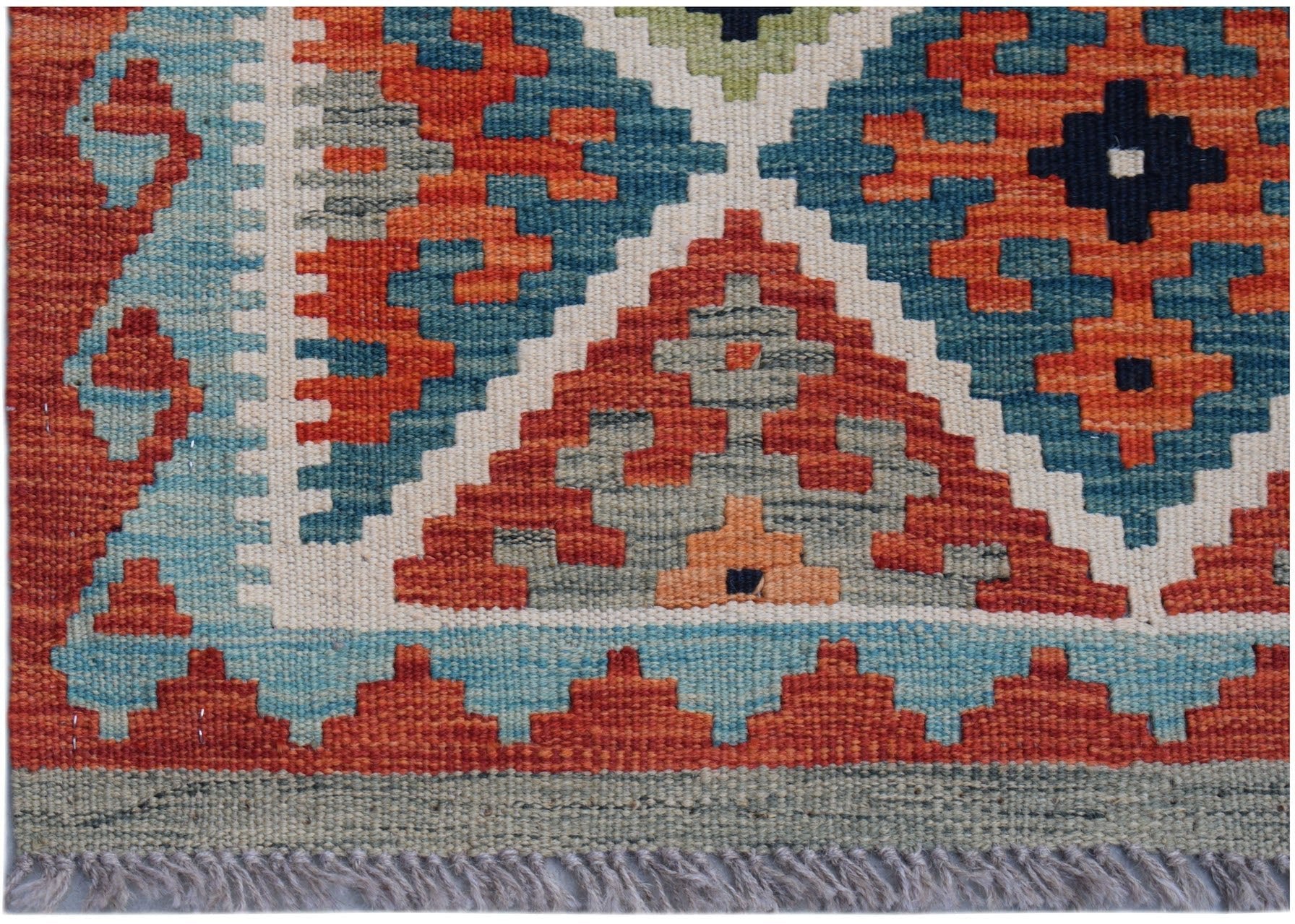 Handwoven Afghan Maimana wool runner featuring a geometric pattern in orange, blue, and grey.