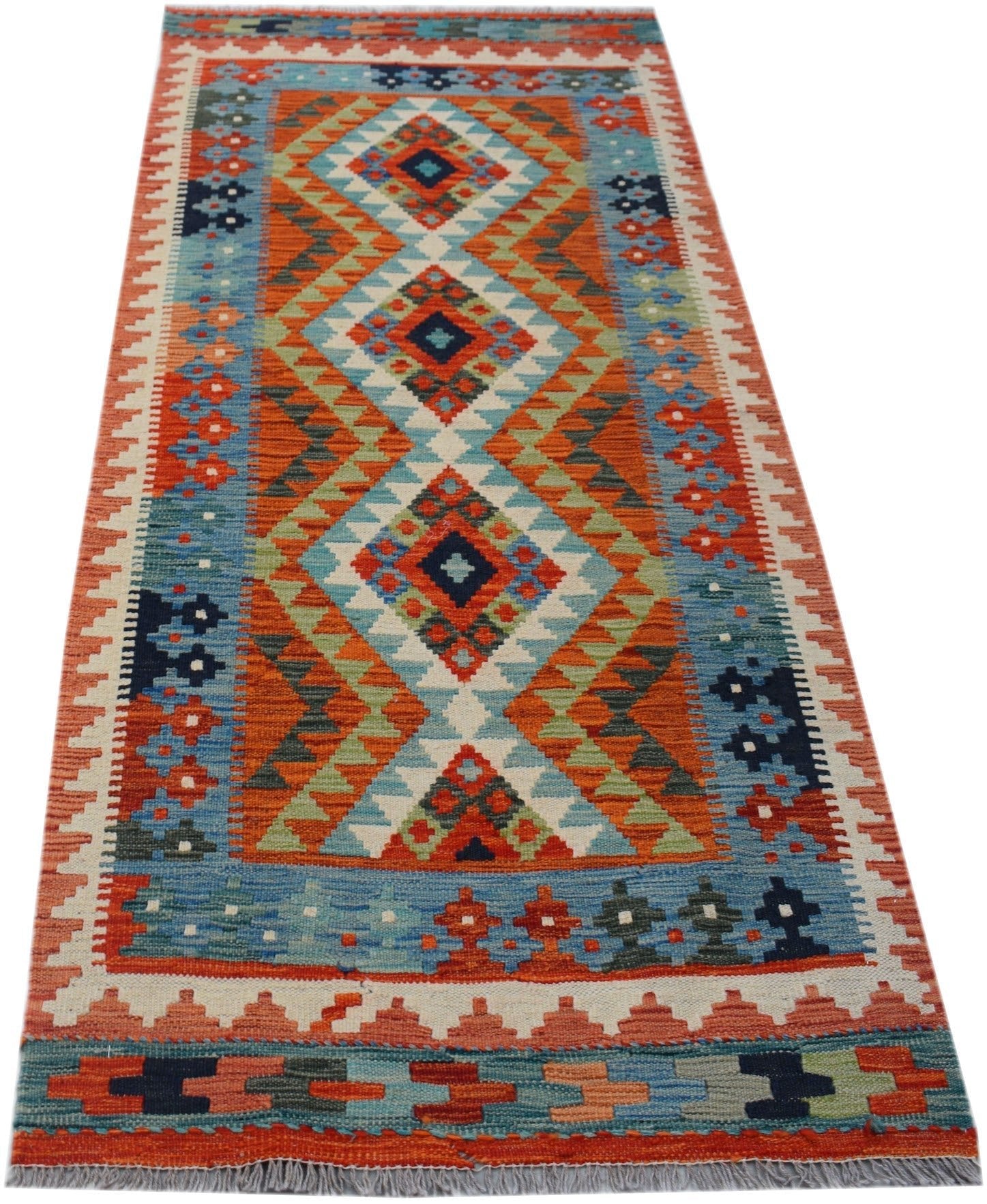 Handwoven Afghan Maimana wool runner rug featuring a colorful geometric diamond pattern.